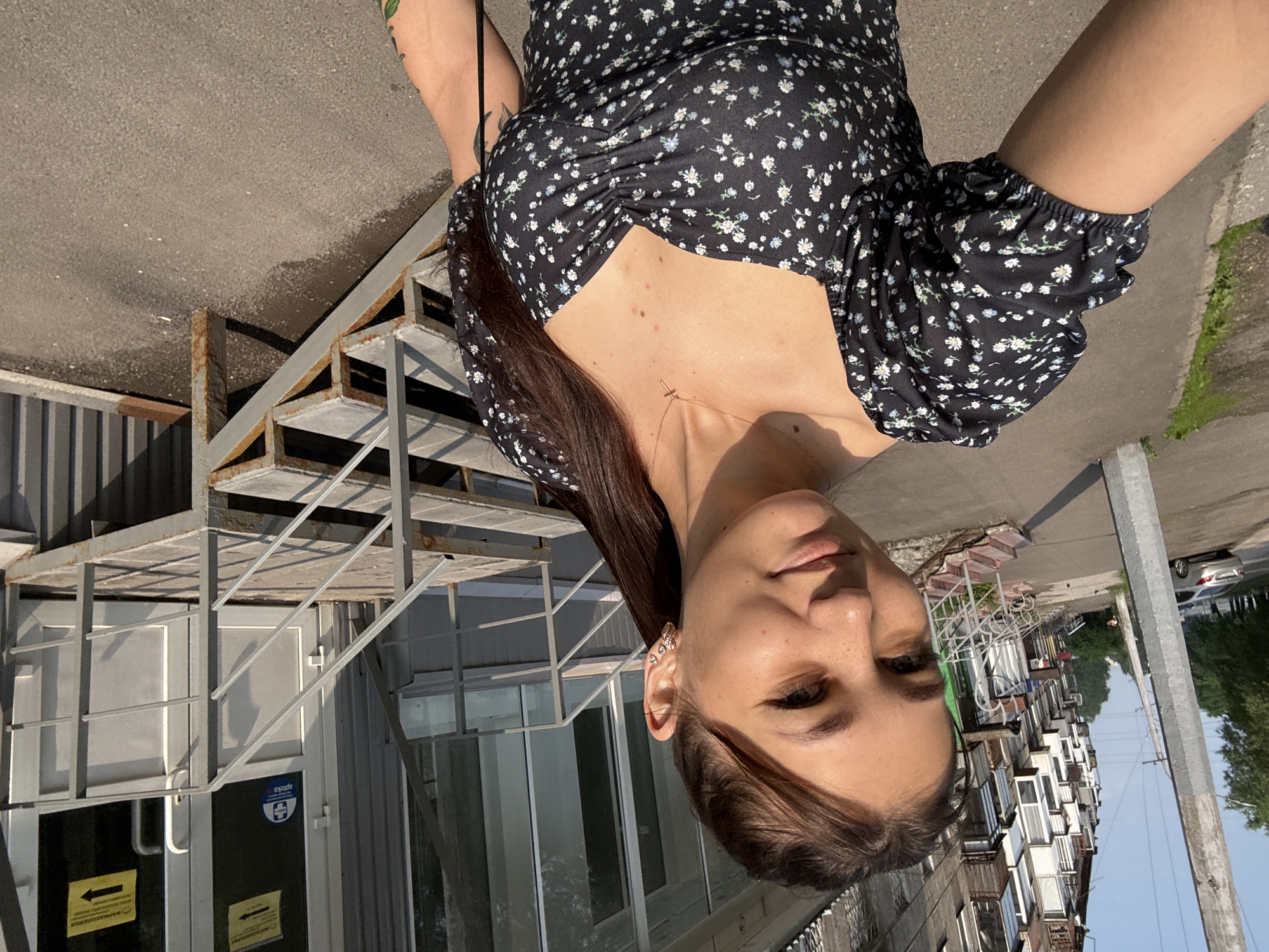 Sunny selfie session on a Novokuznetsk sidewalk