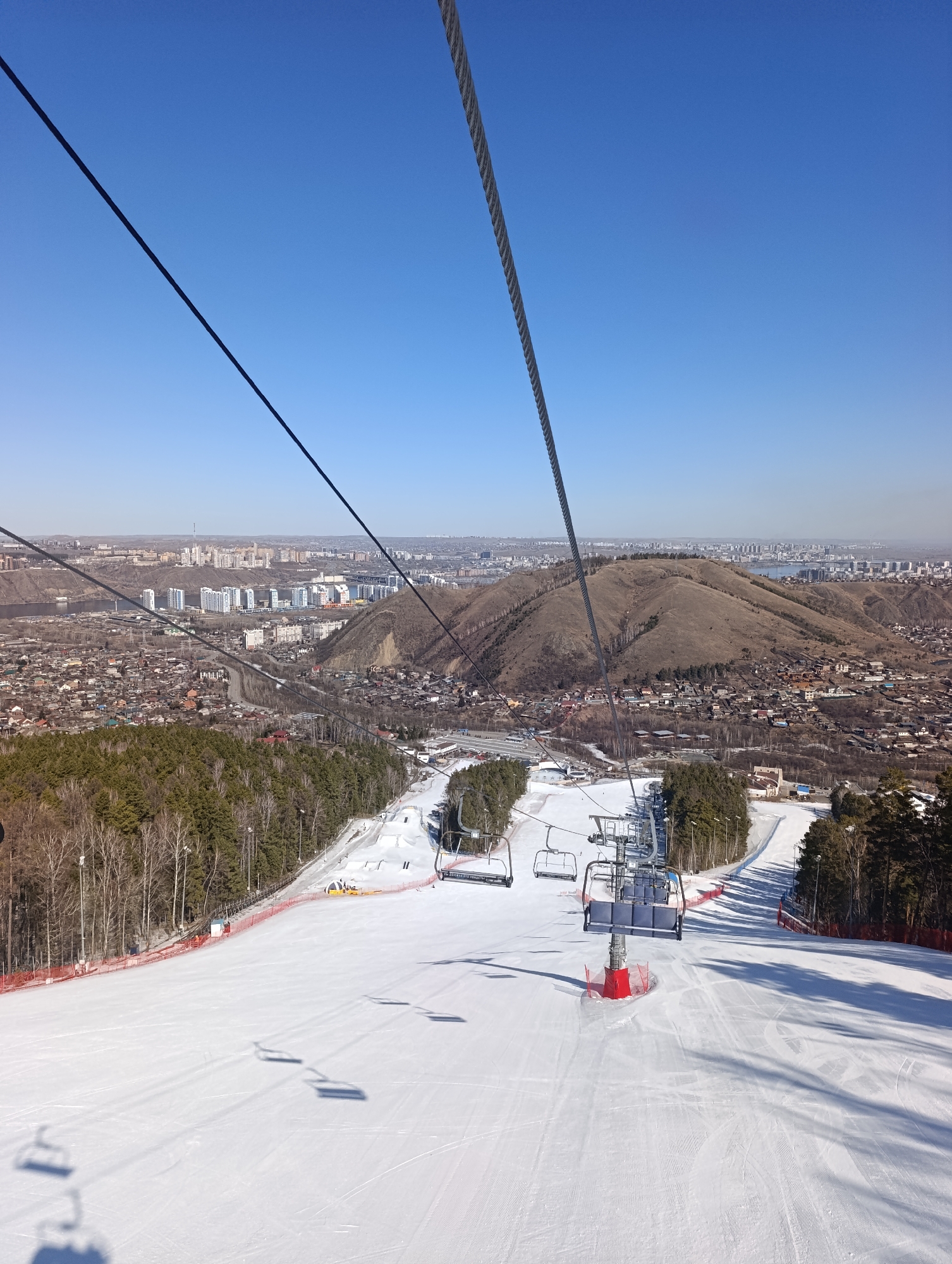 Cable car riders capture panoramic views of Krasnoyarsk ski resort