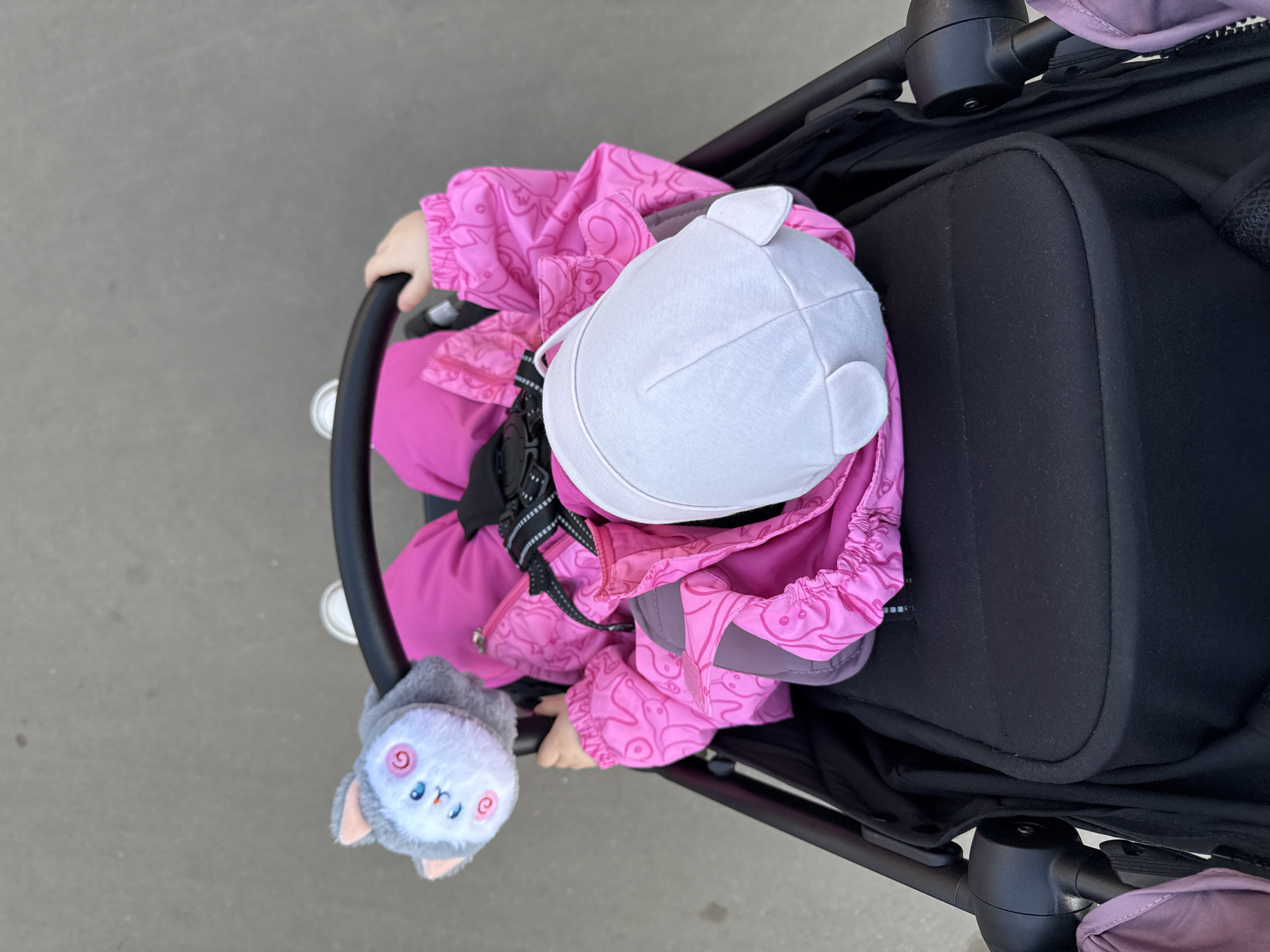 Mother takes selfie with child in stroller in Moscow