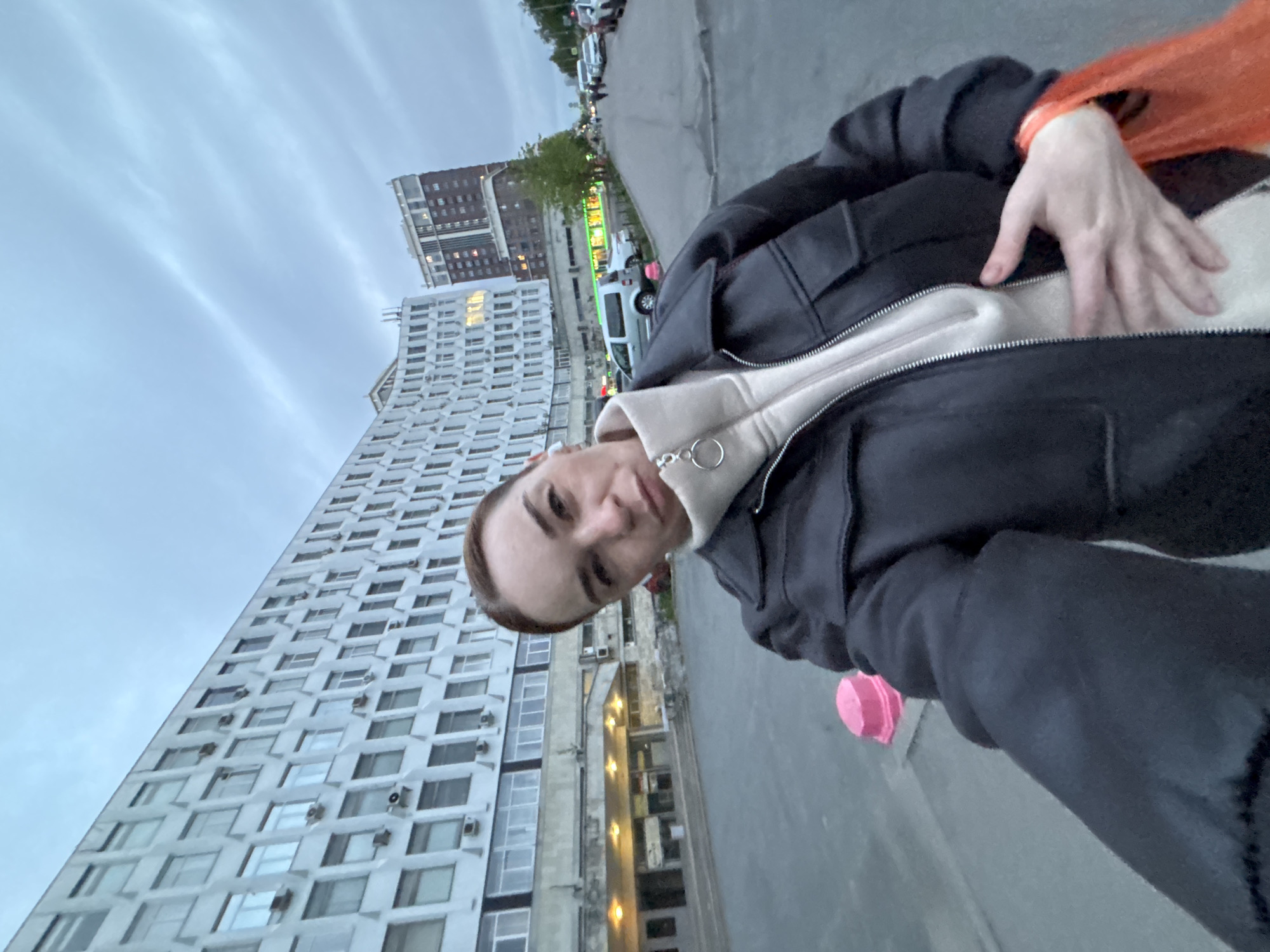 Person documents evening city walk with selfies and street scenes