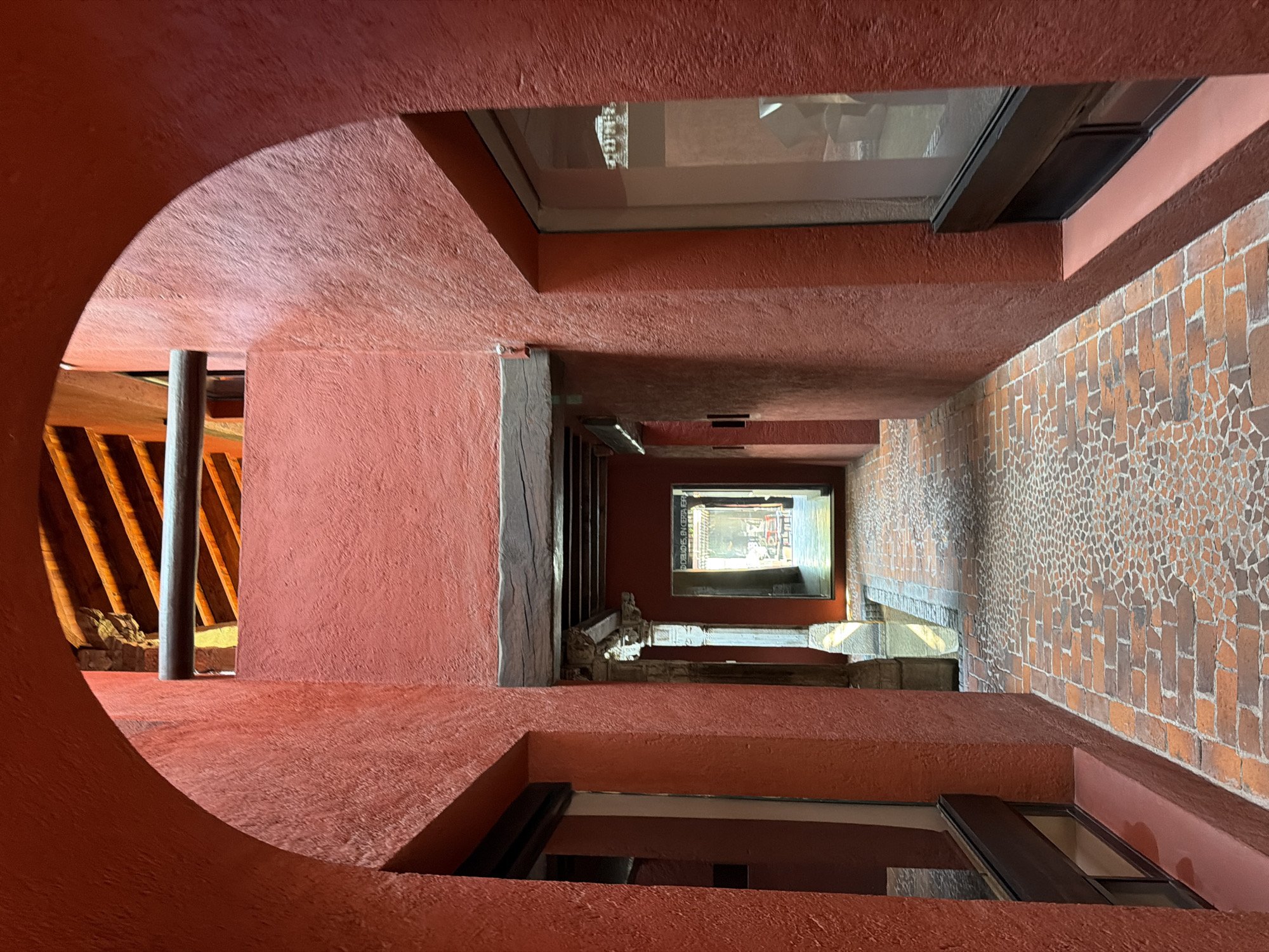 Visitor documents architectural details during afternoon stroll in Puebla