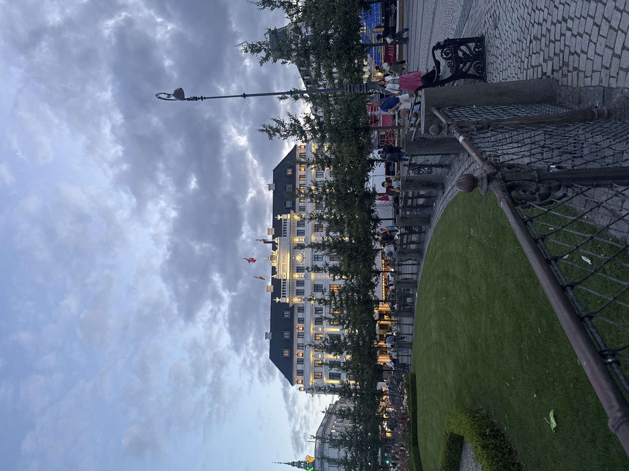 Hotel D'Angleterre glows at dusk over Kongens Nytorv