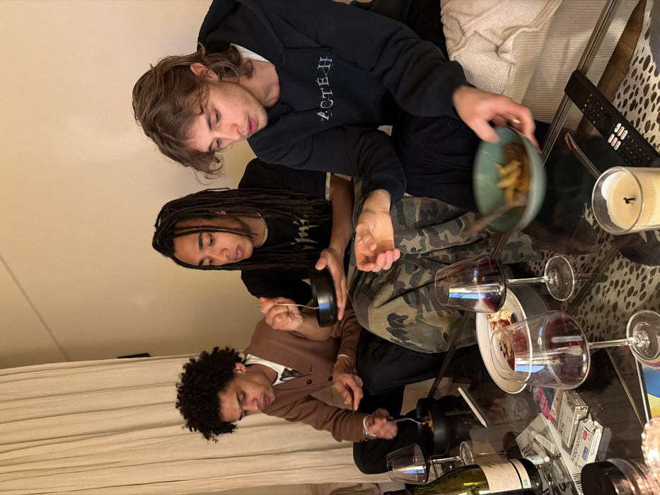 Young men share casual evening meal in Paris residence