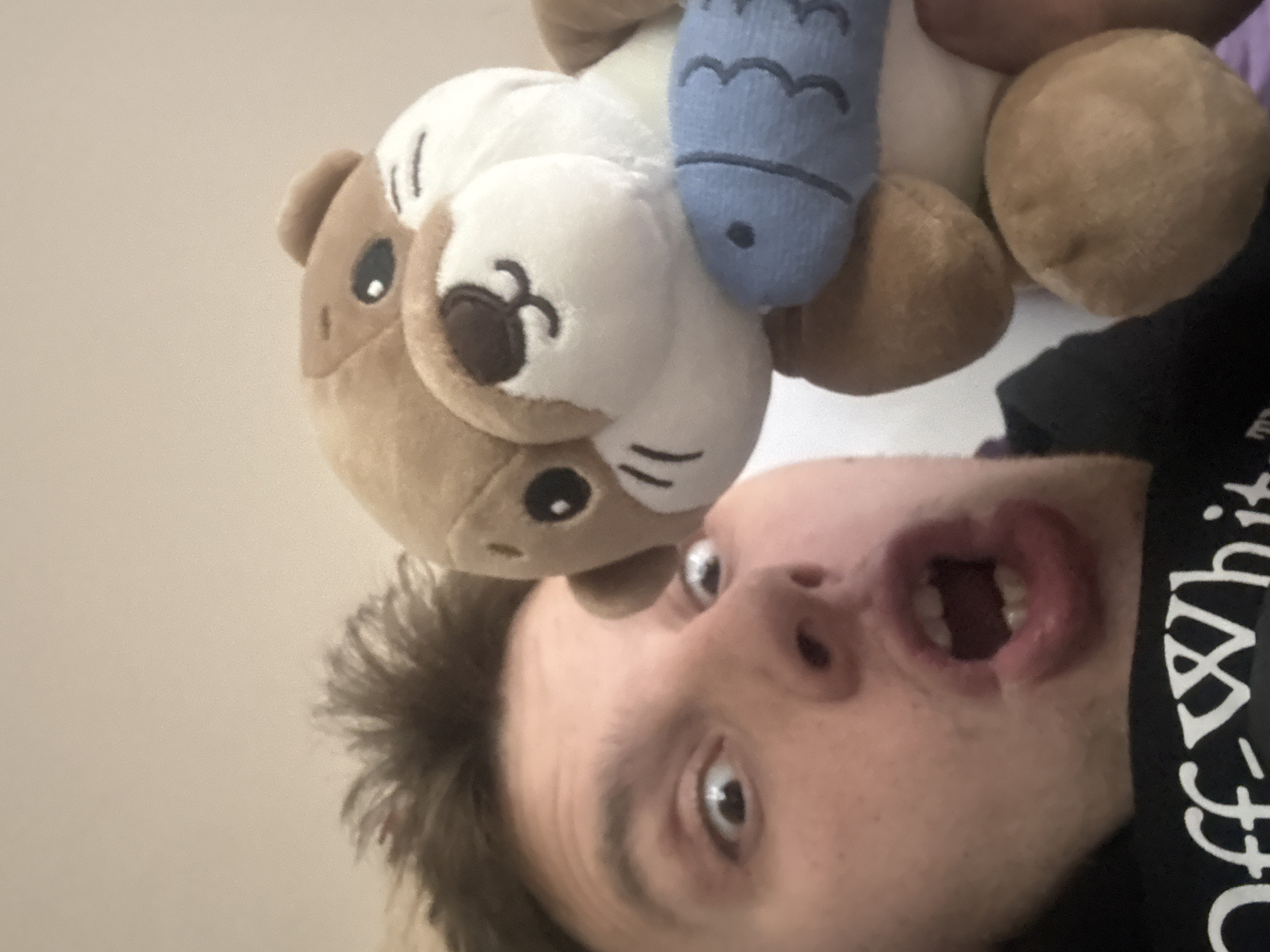 Playful selfie with plush otter toy in Plovdiv