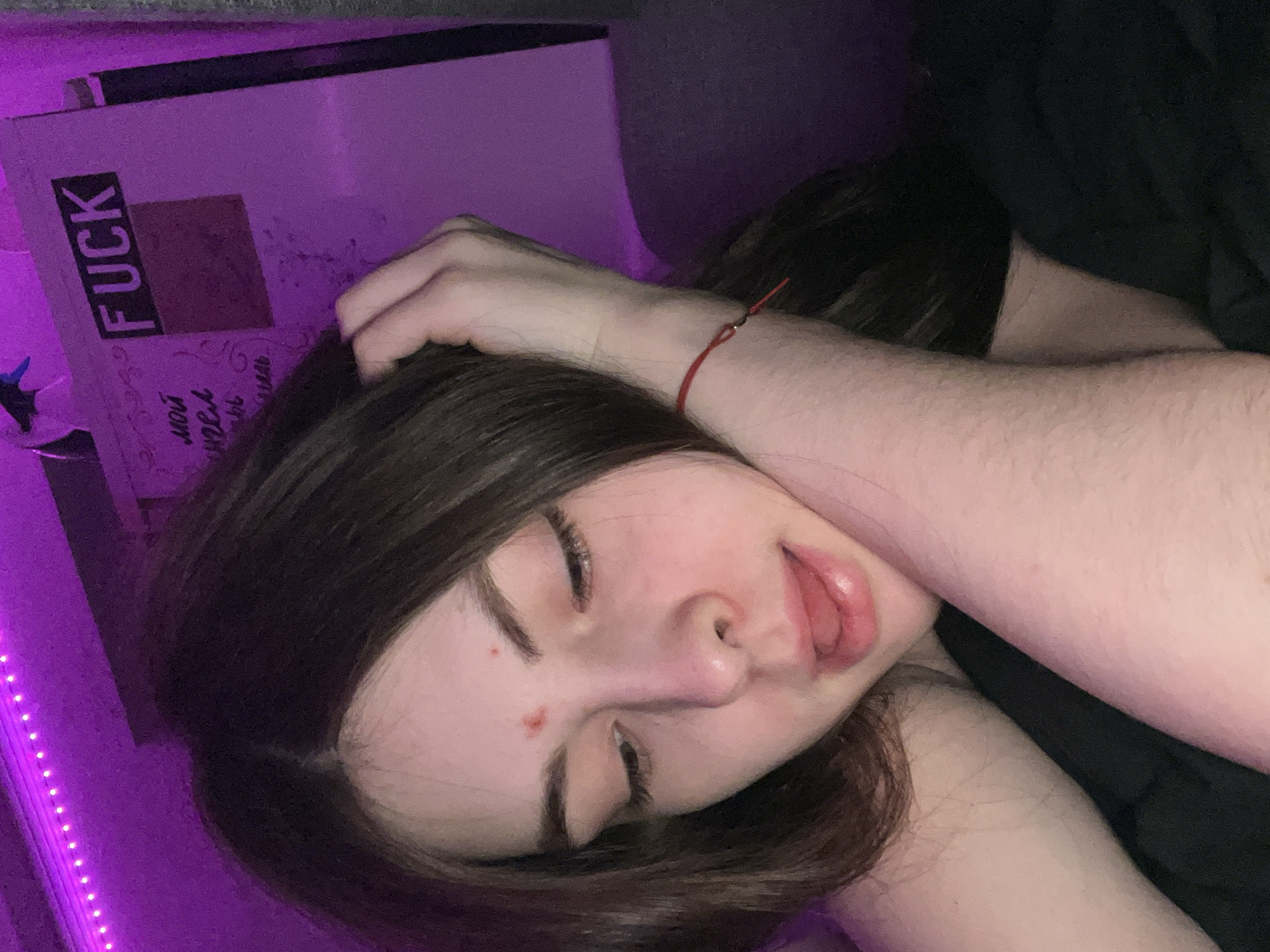 Private photo session captured in purple-lit Saint Petersburg apartment