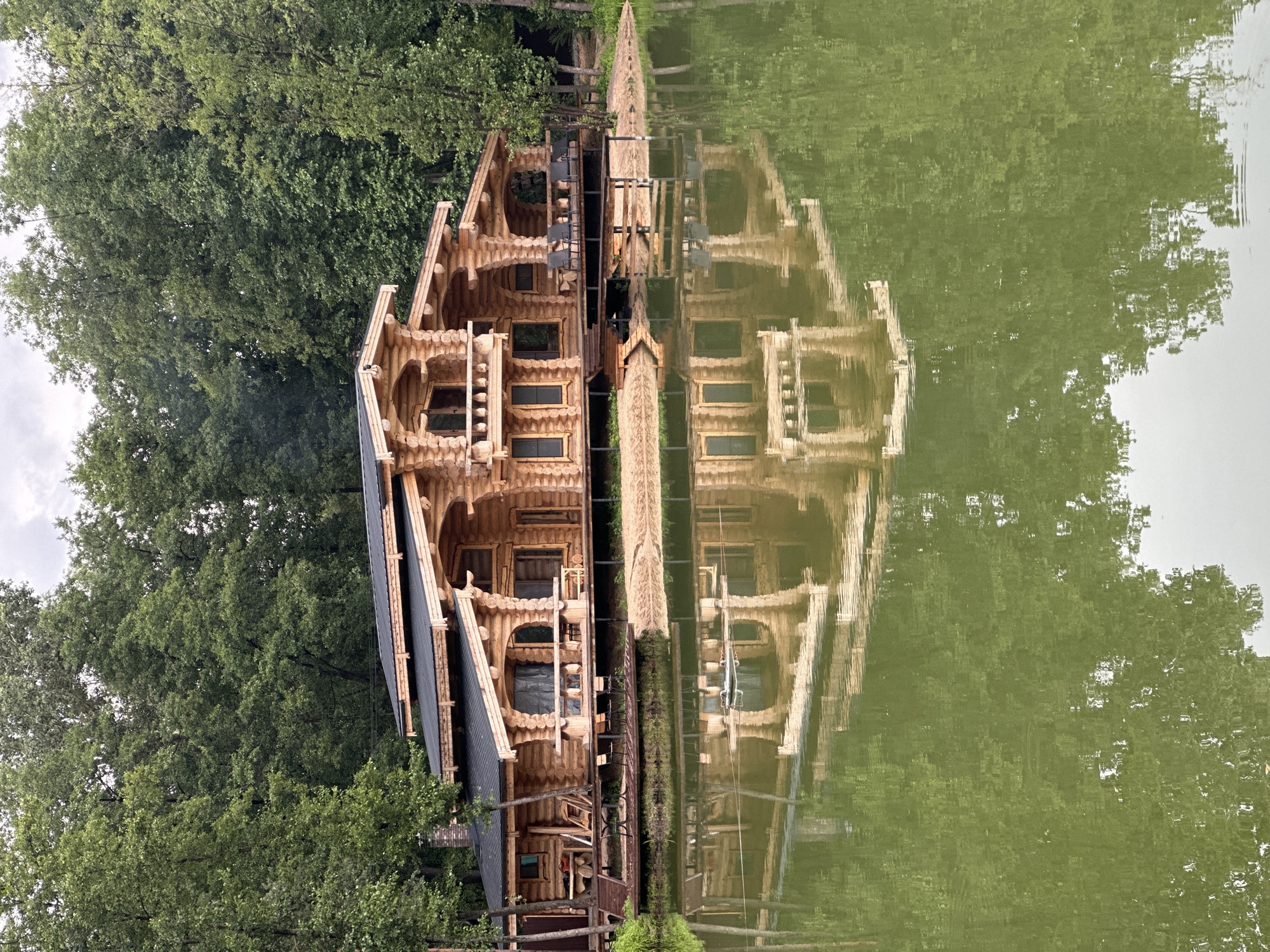Log cabin, pier, and paddleboards at a Lipetsk lakeside retreat