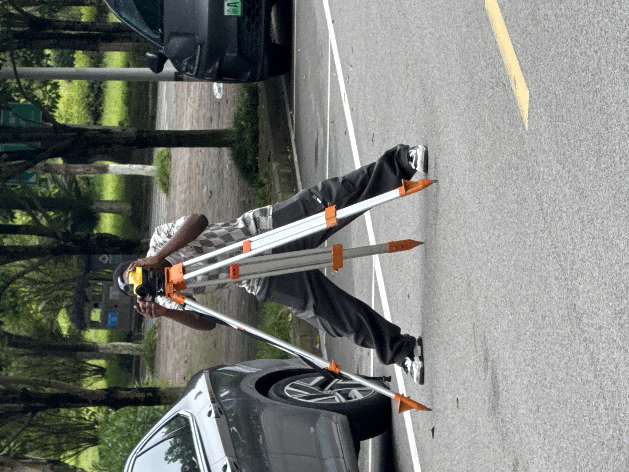 Survey crews and scooter traffic fill Jiangjin streets on a June morning