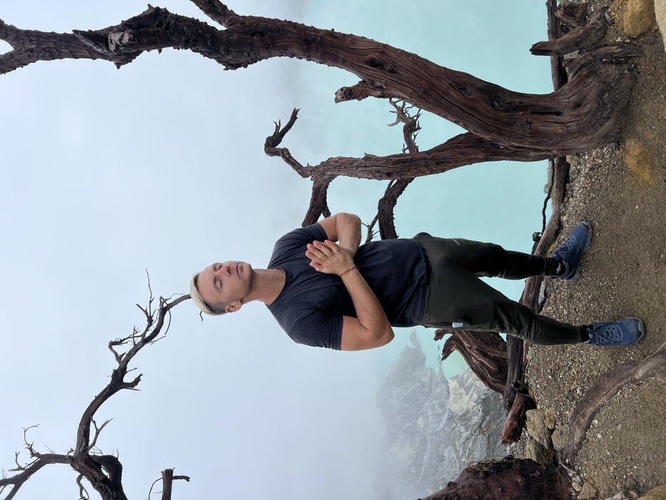 Hikers navigate foggy mountain terrain in Indonesia