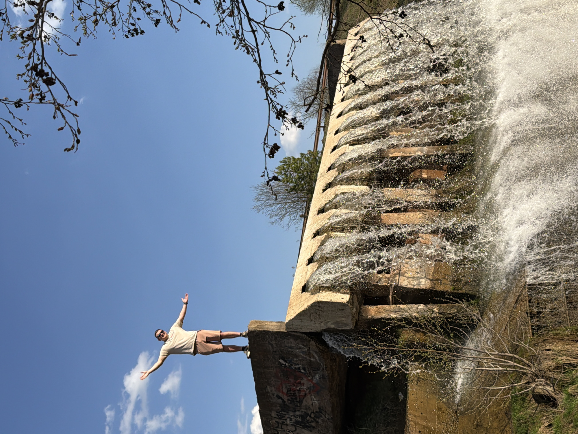 Man visits concrete waterfall structure in Kamennoye, Russia
