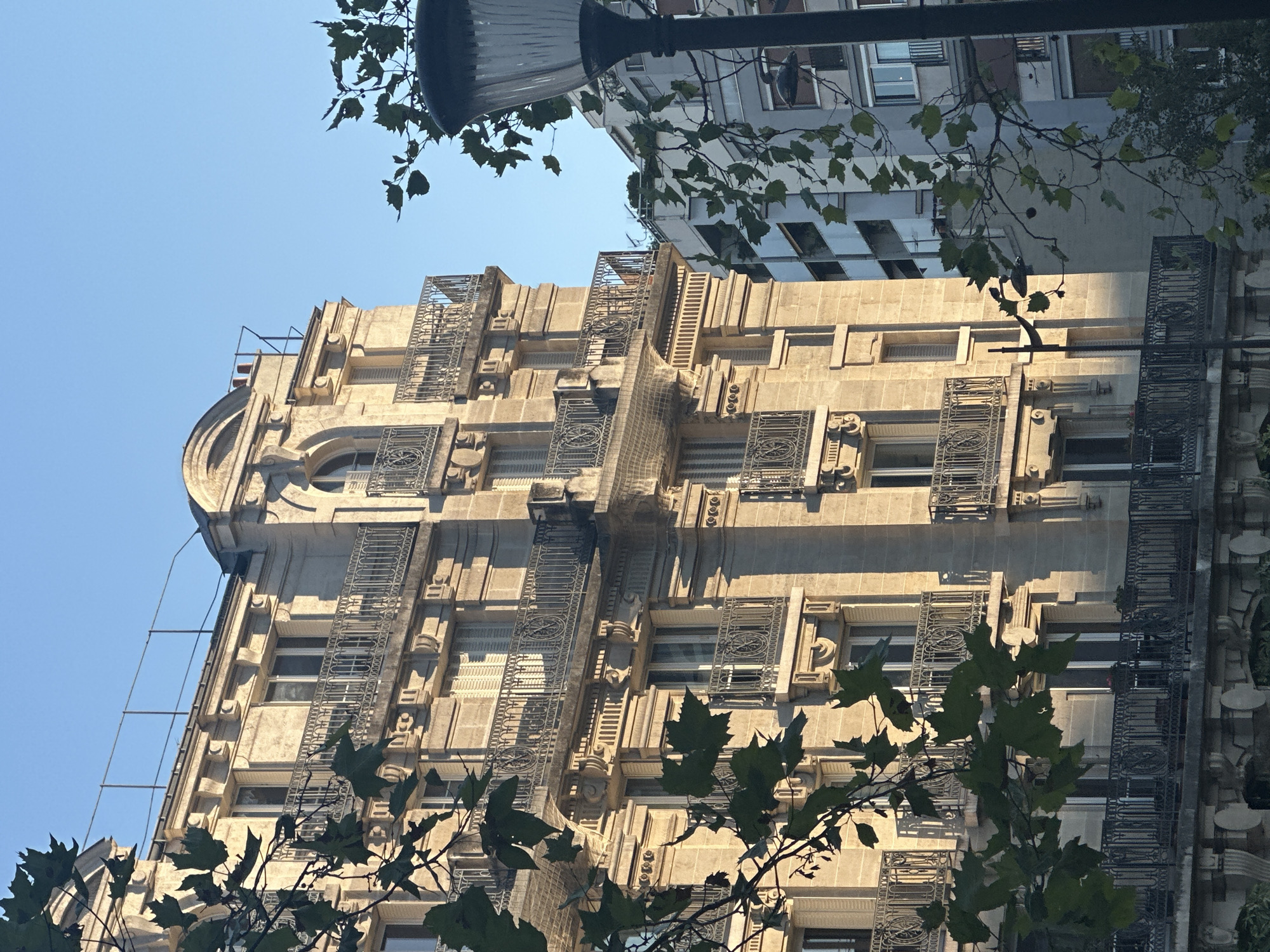 Haussmannian streetscape in Paris on a clear afternoon
