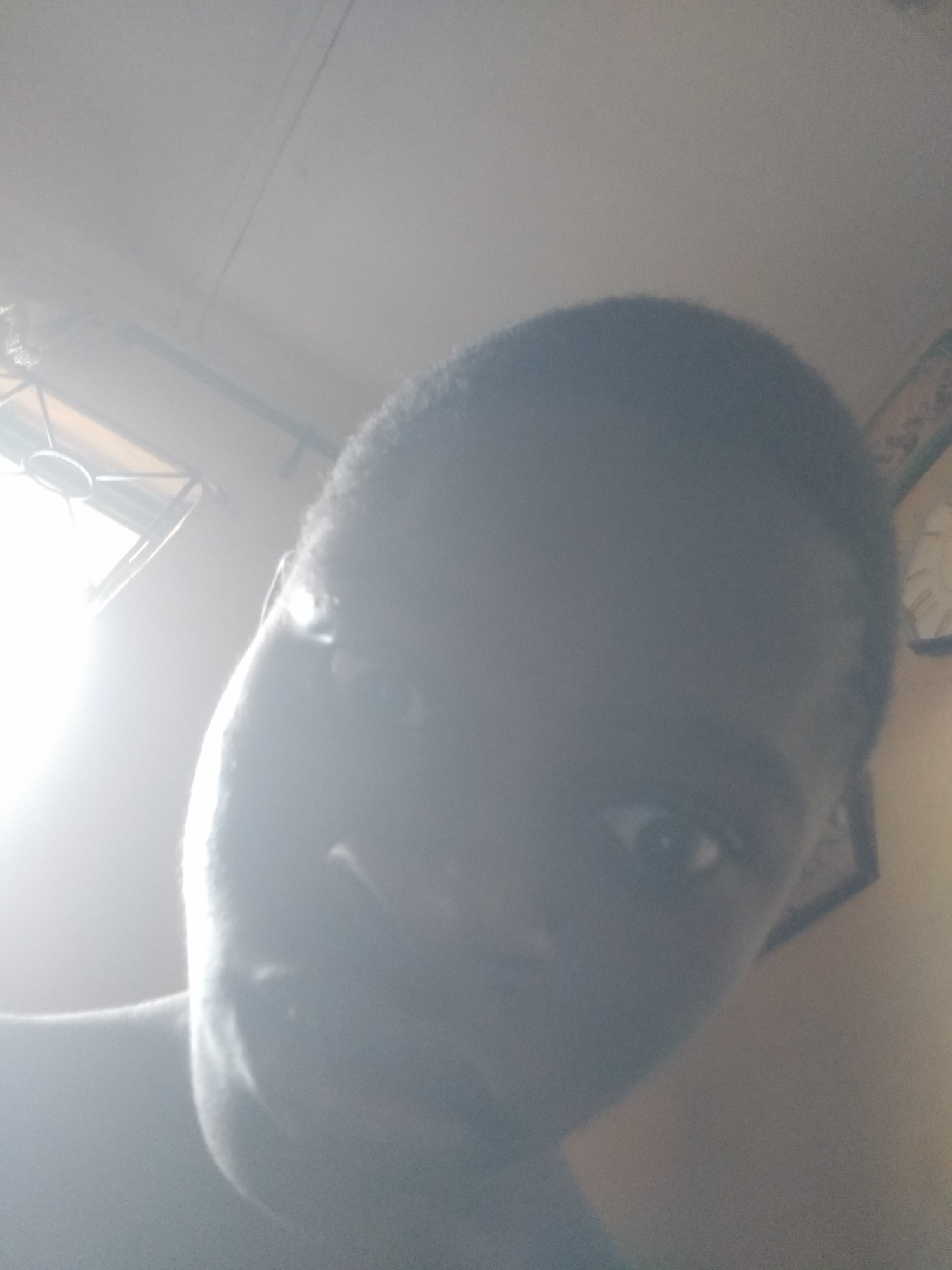 Young person takes playful selfie series in Shangisha, Nigeria