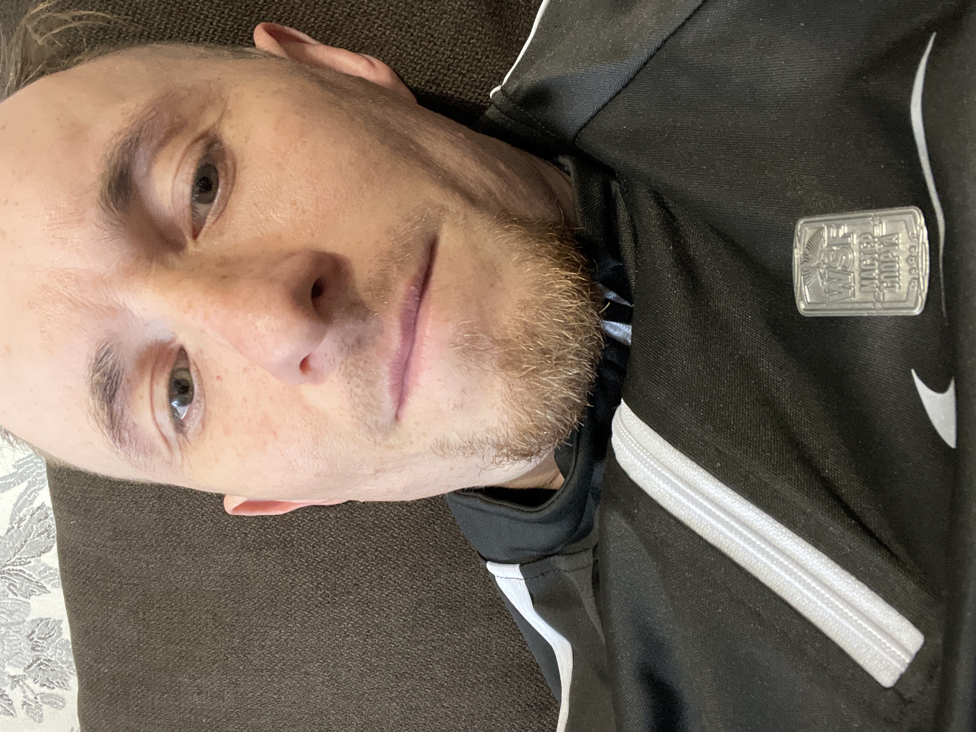 Man resting on couch captured in Sarapul indoor footage