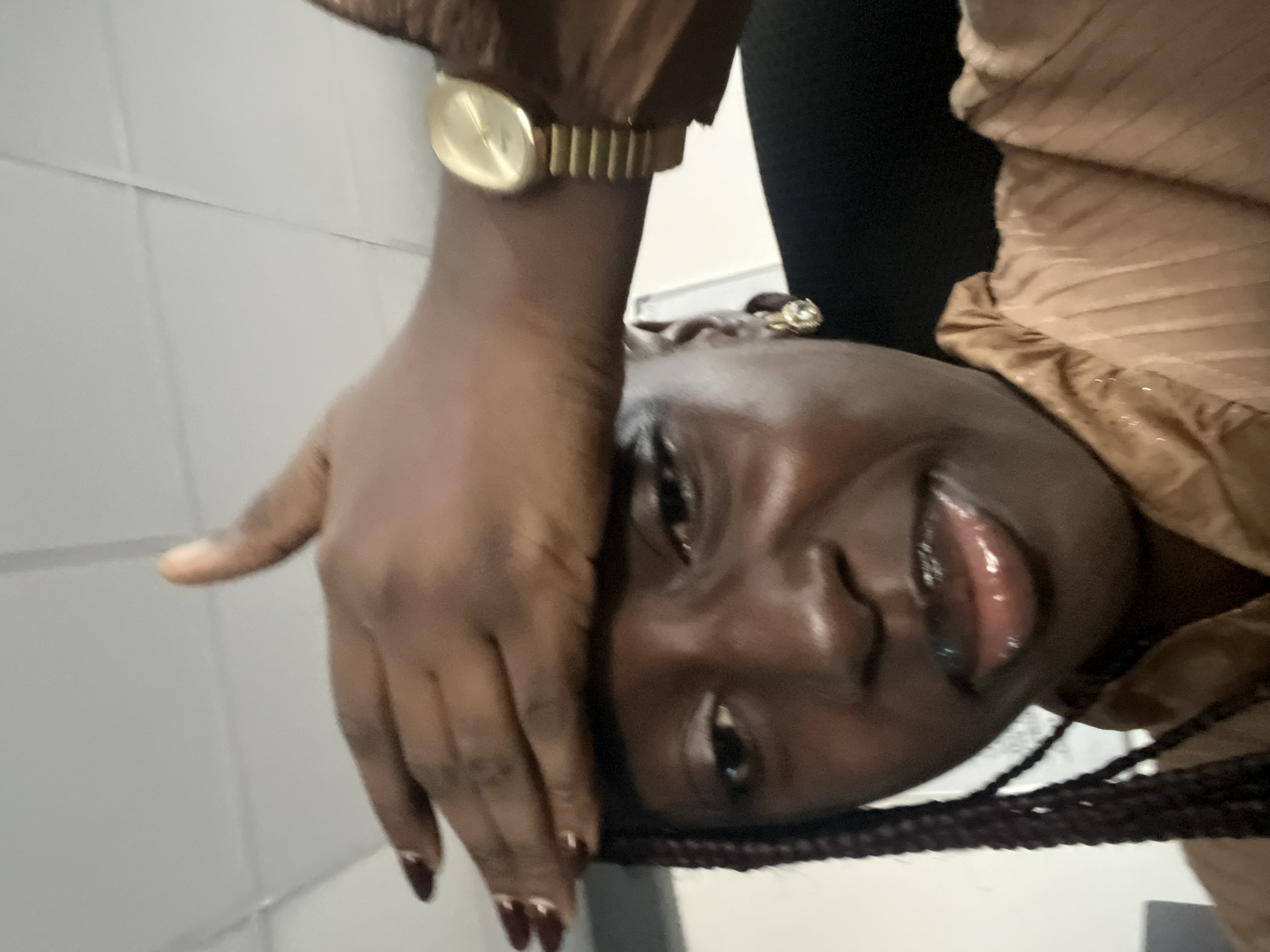 Woman takes selfie in office setting in Karum, Nigeria