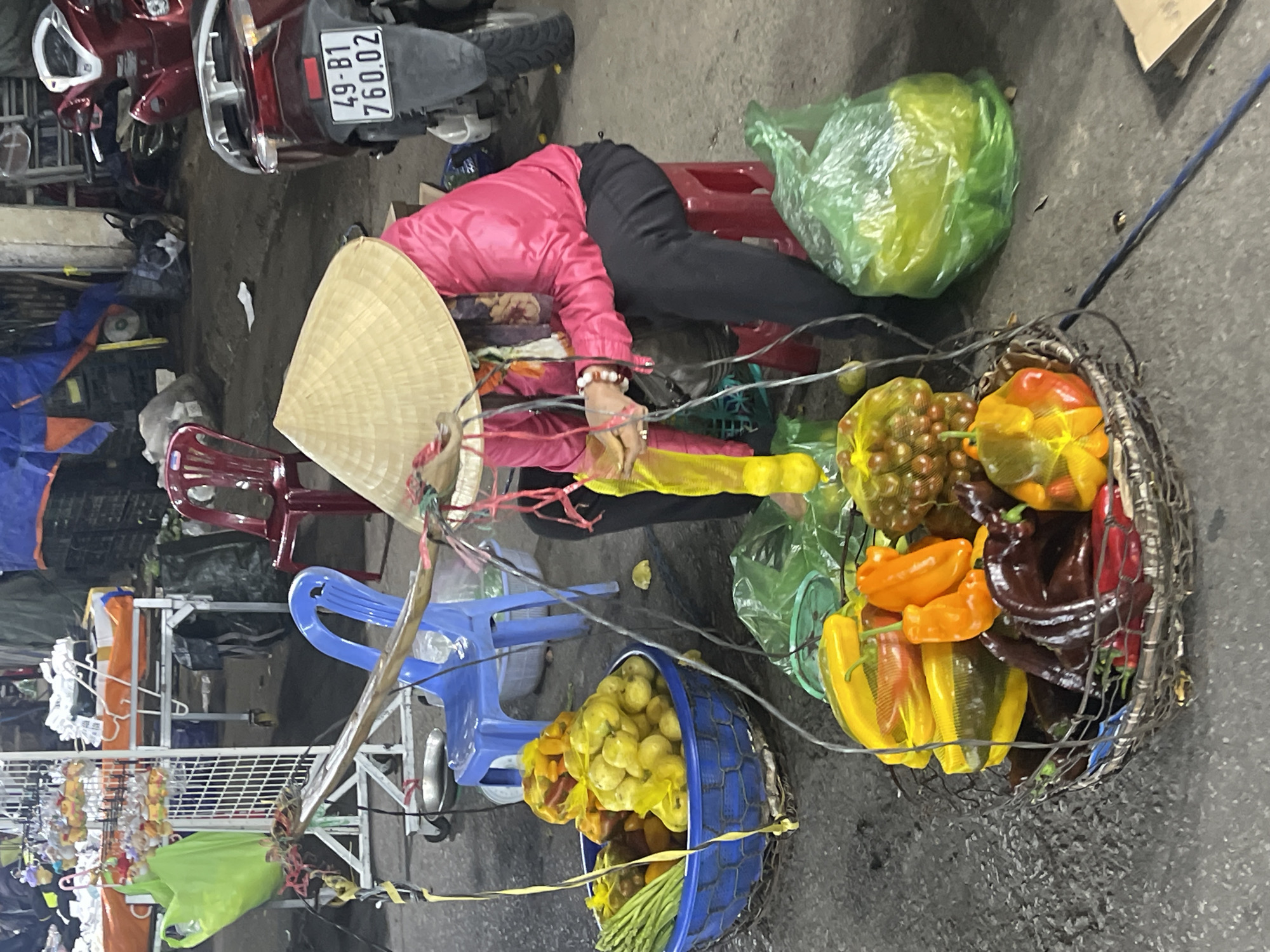 Street vendor sells fresh produce at Da Lat market
