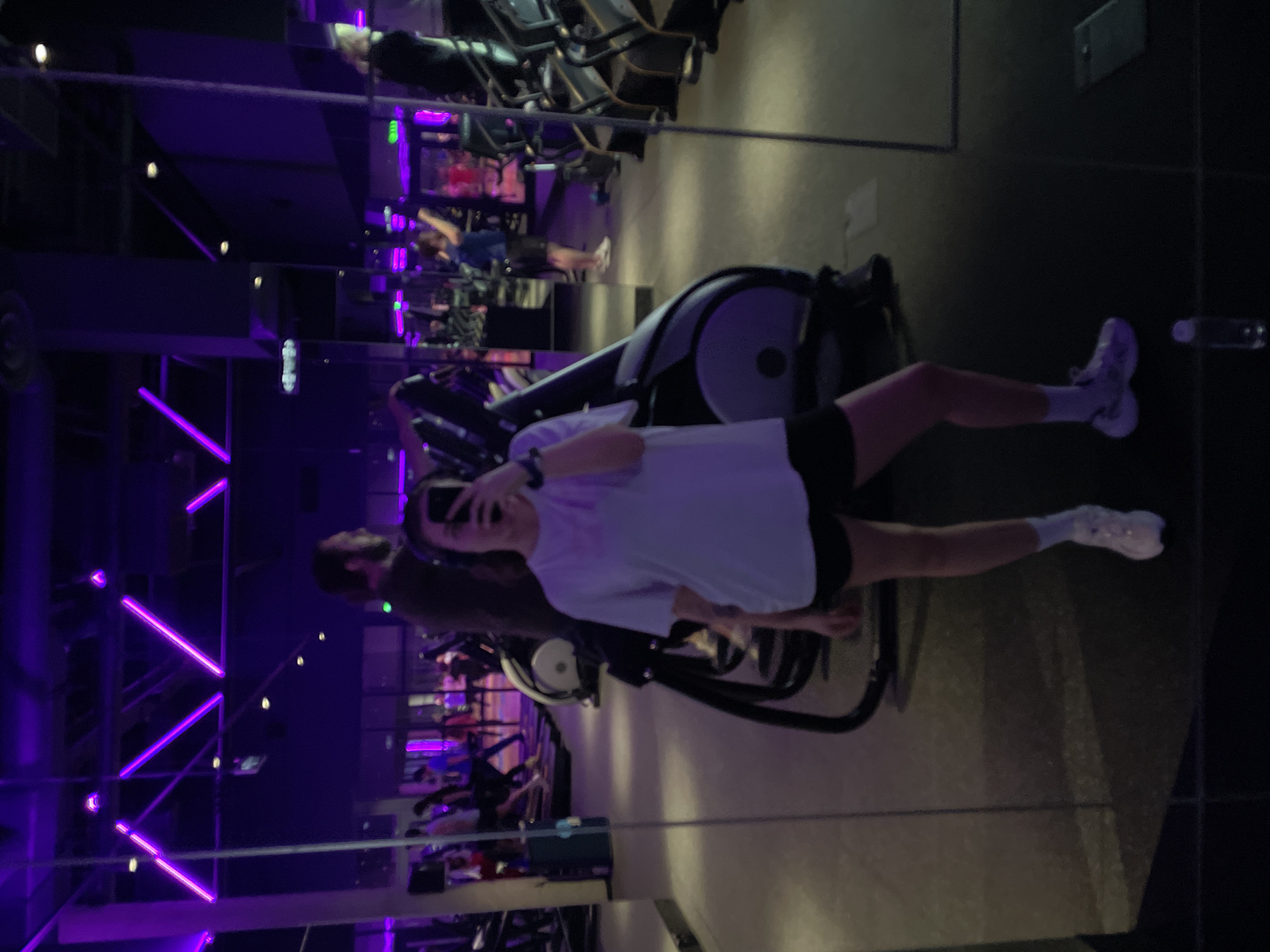 Gym selfies captured at purple-lit Moscow fitness center