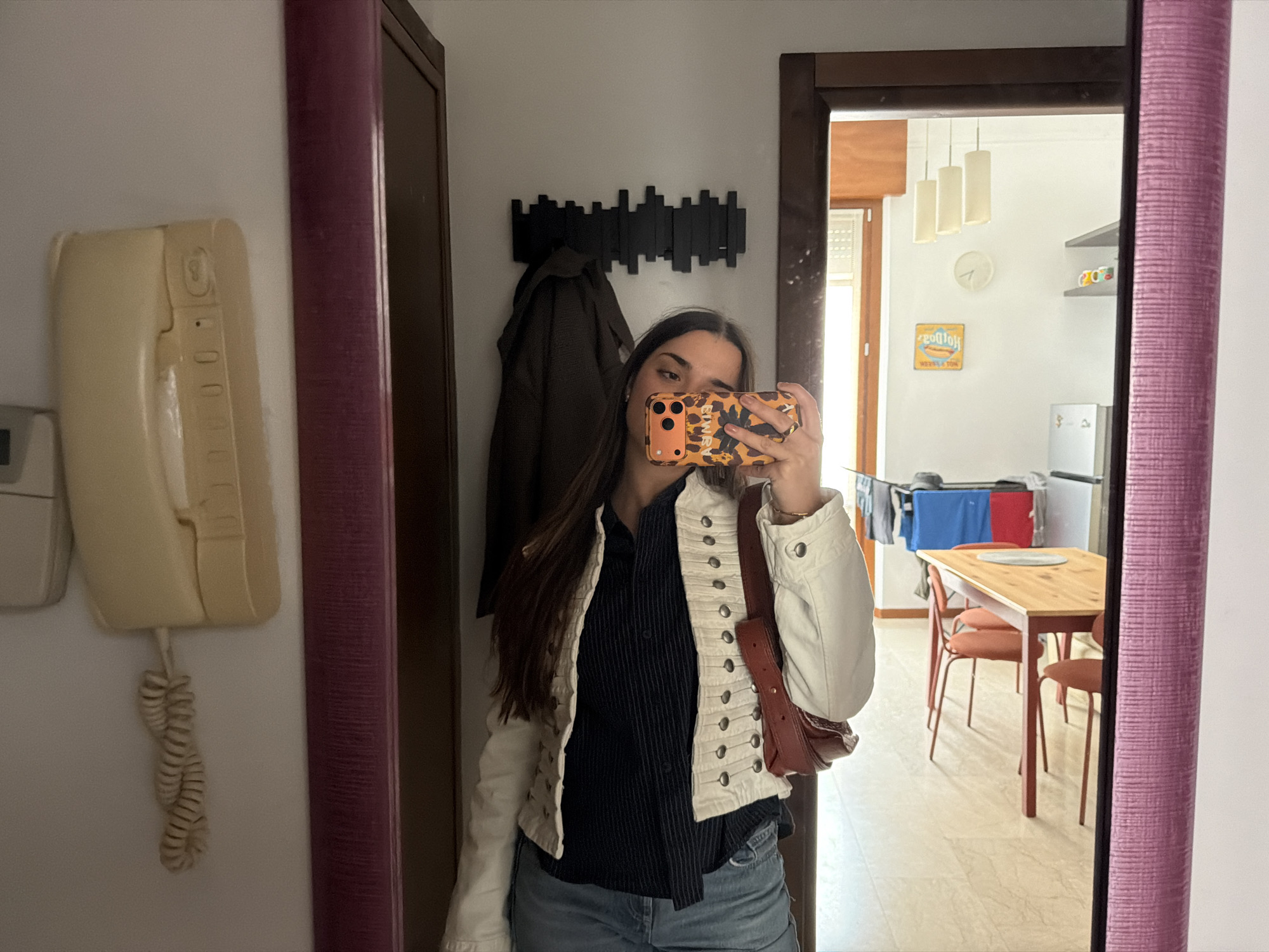 Person takes mirror selfie in Milan