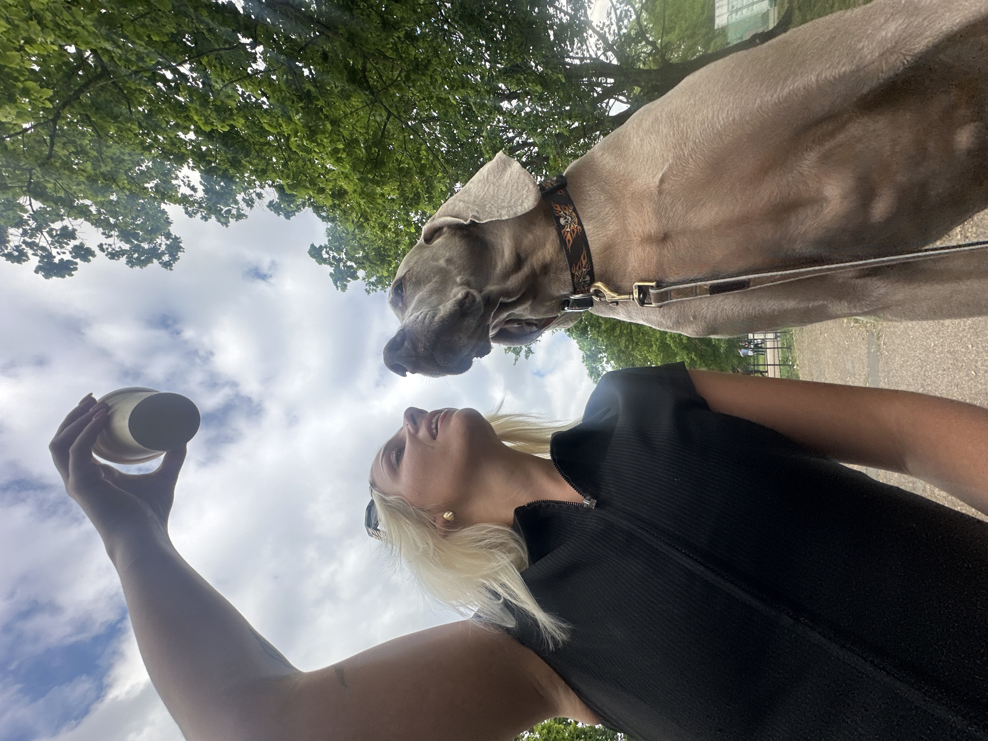 Woman with dog spotted in London park afternoon