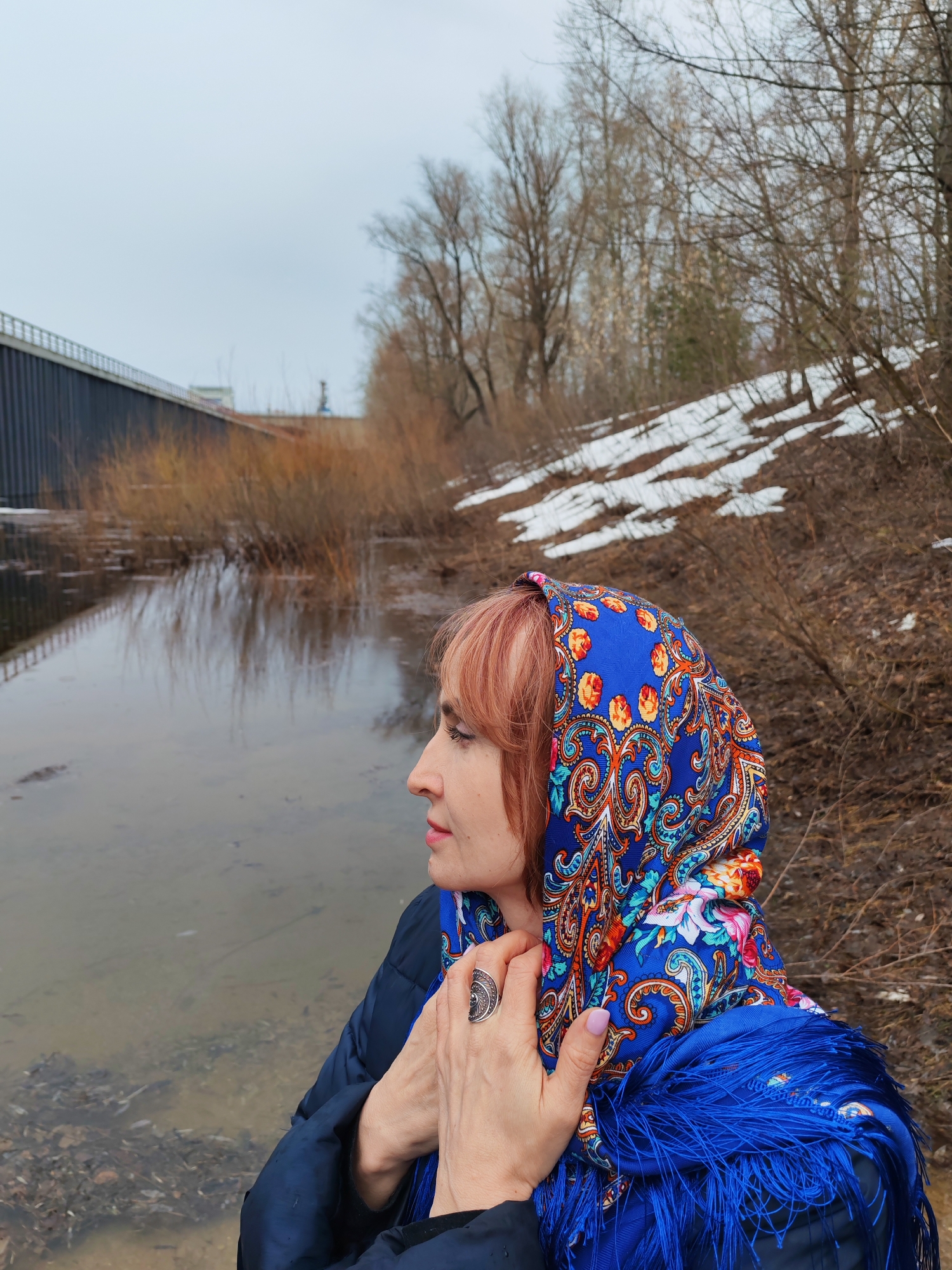 Two people spend quiet moments by Kama River in Chaikovsky