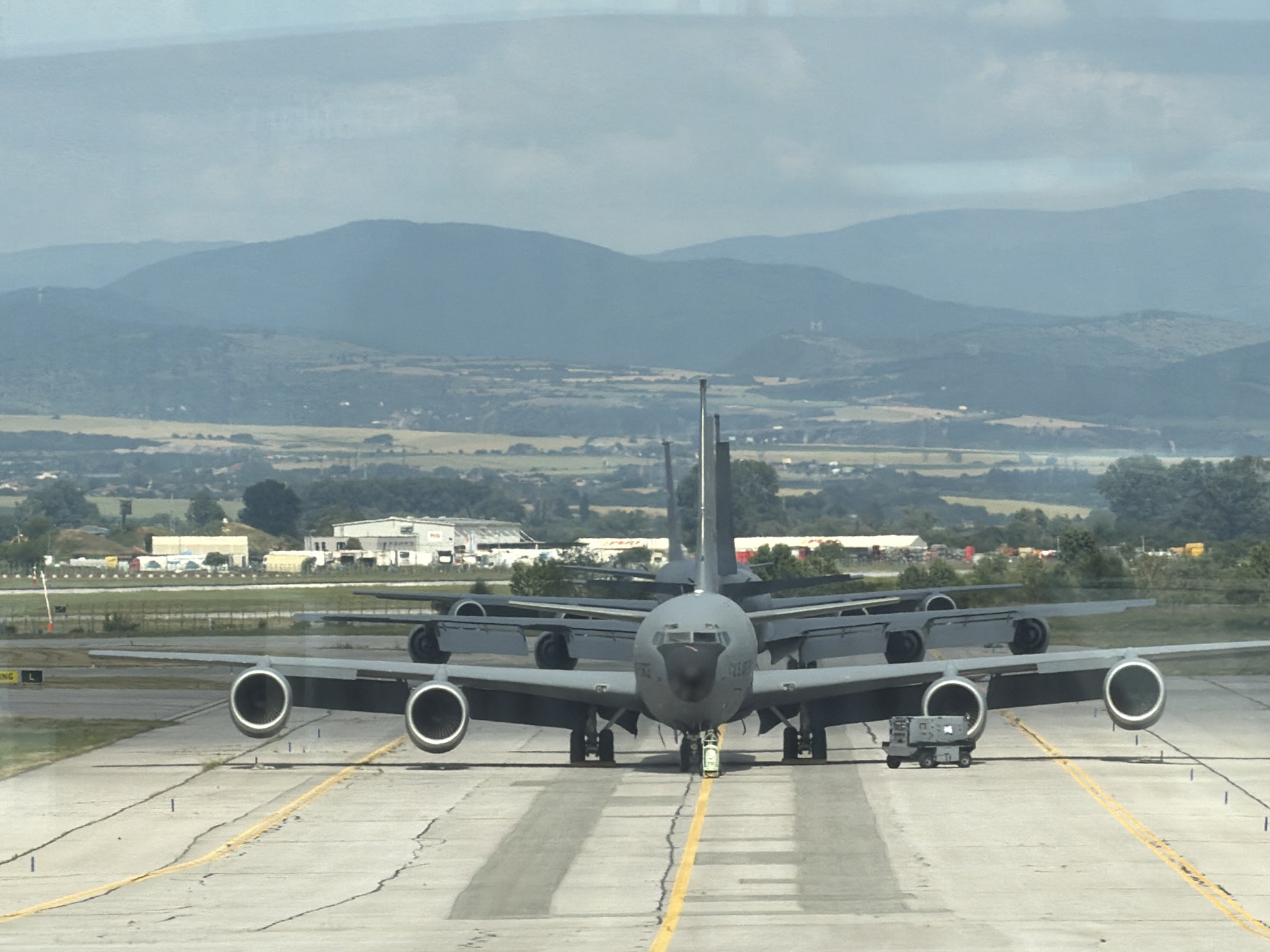 Military and commercial aircraft share the tarmac at Sofia Airport