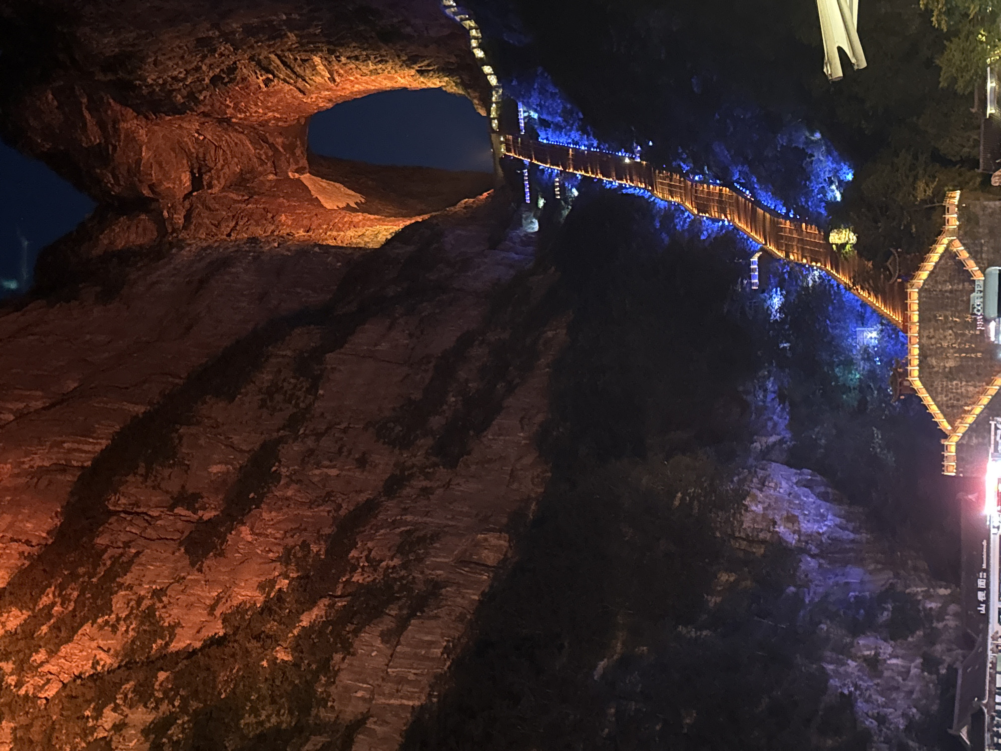 Tianmen Mountain's lit arch and skywalk at night