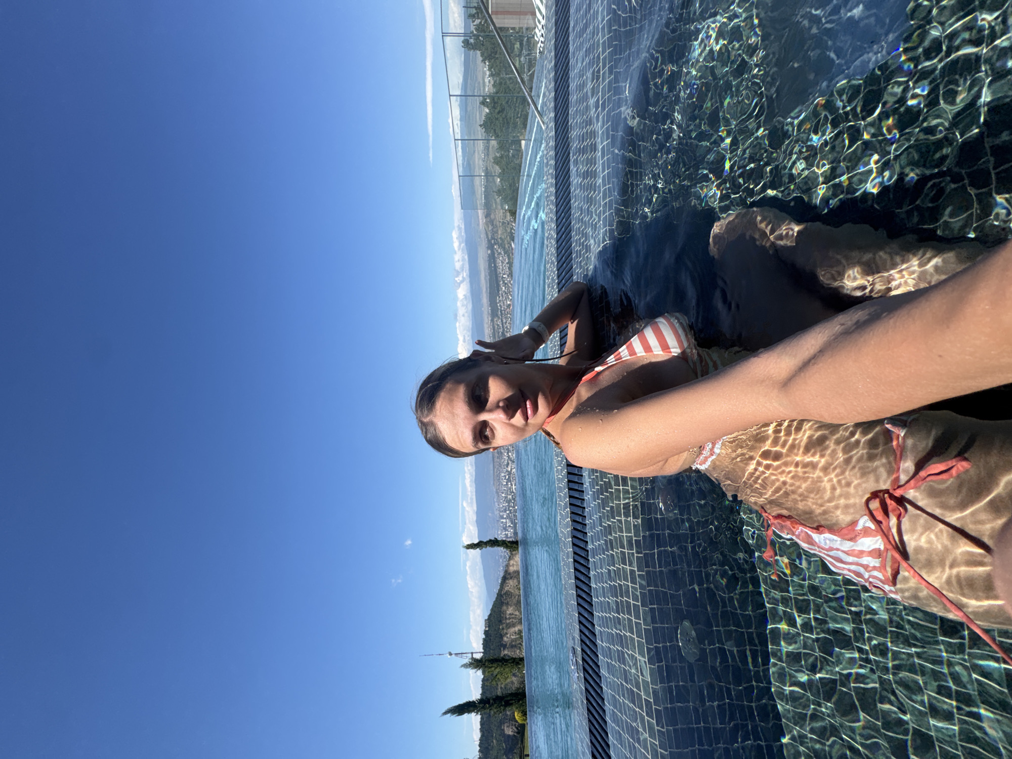 Rooftop infinity pool session overlooking Tbilisi on a summer morning