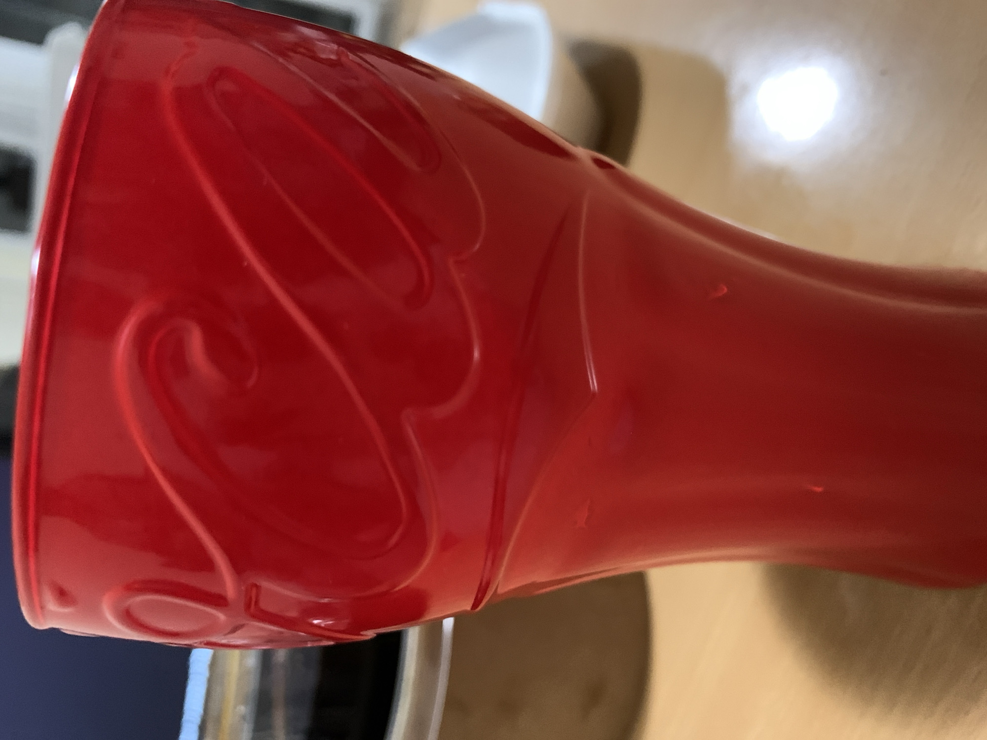 Red Coca-Cola cup photographed indoors in Sofia
