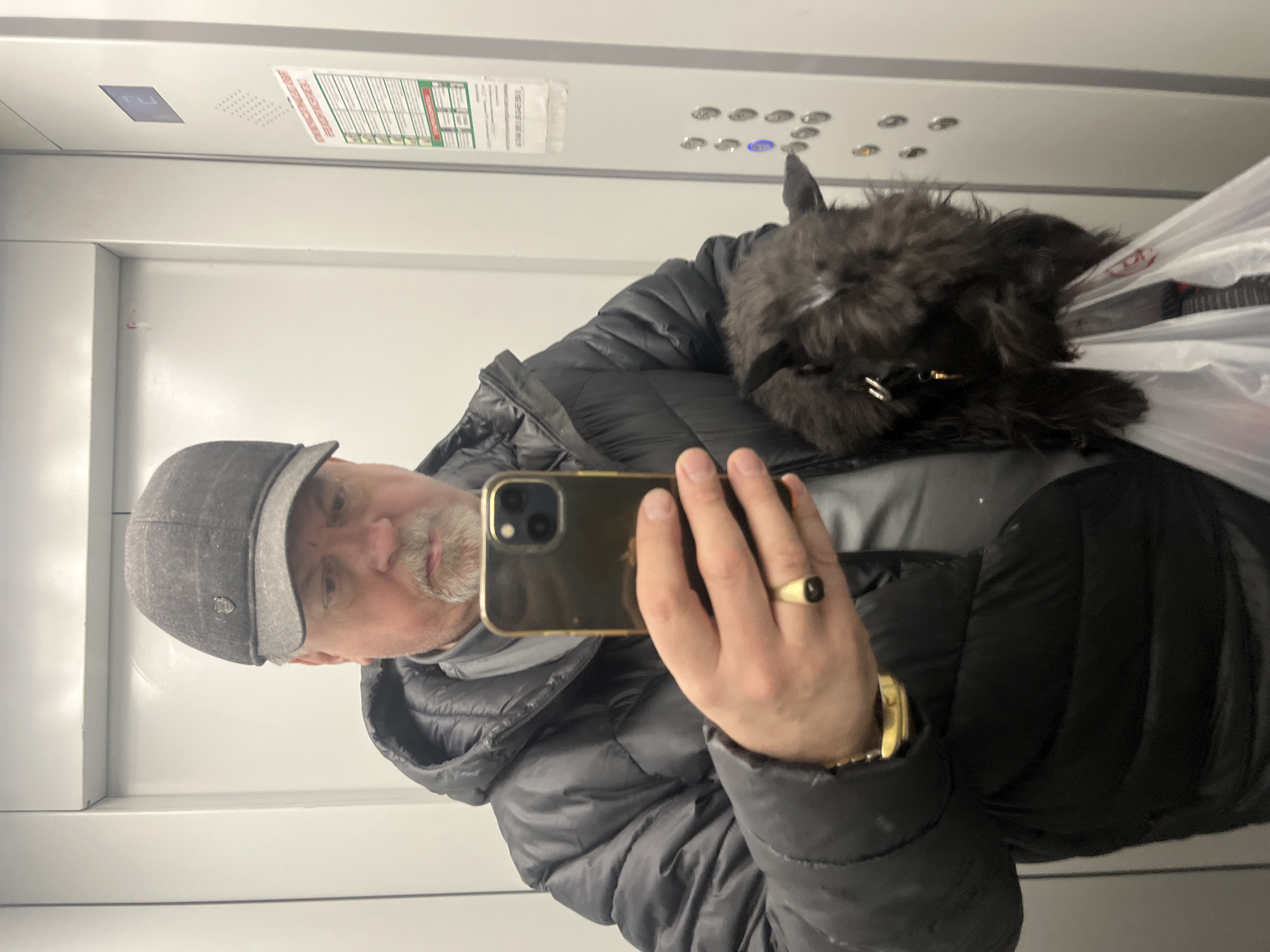 Man takes elevator selfie with small dog in Podolsk