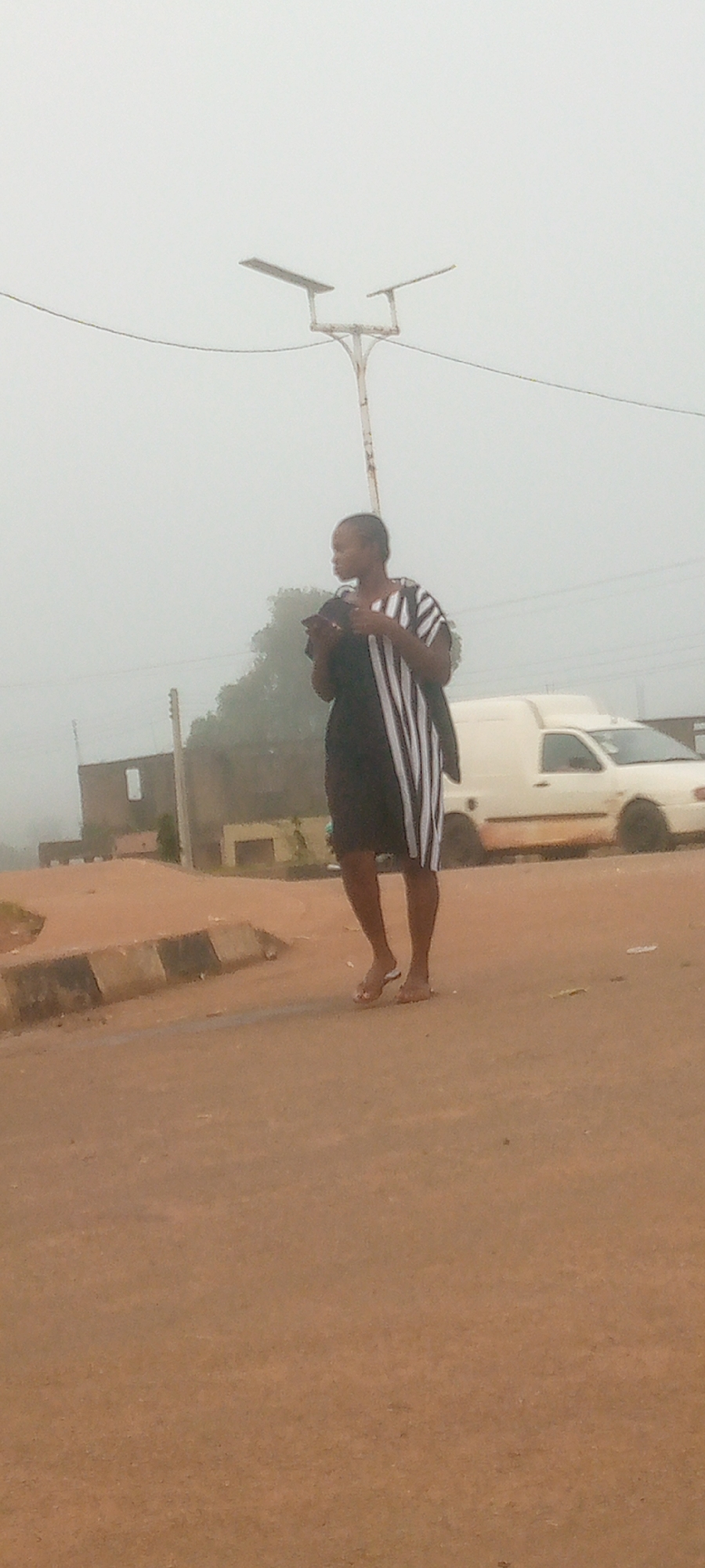 Foggy morning street life in Gura Top, Nigeria