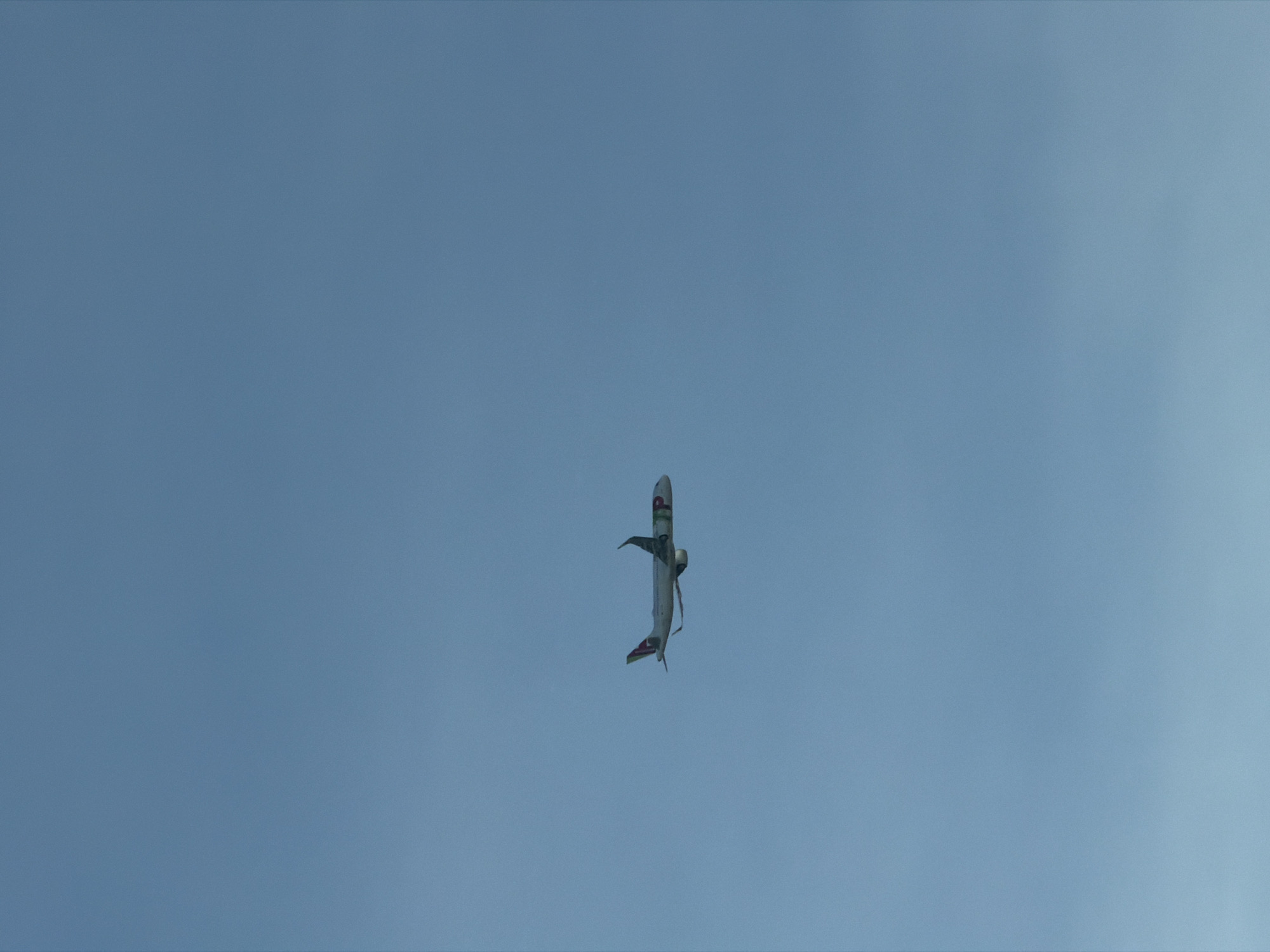 Aircraft photographed in vertical flight orientation over Loures, Portugal