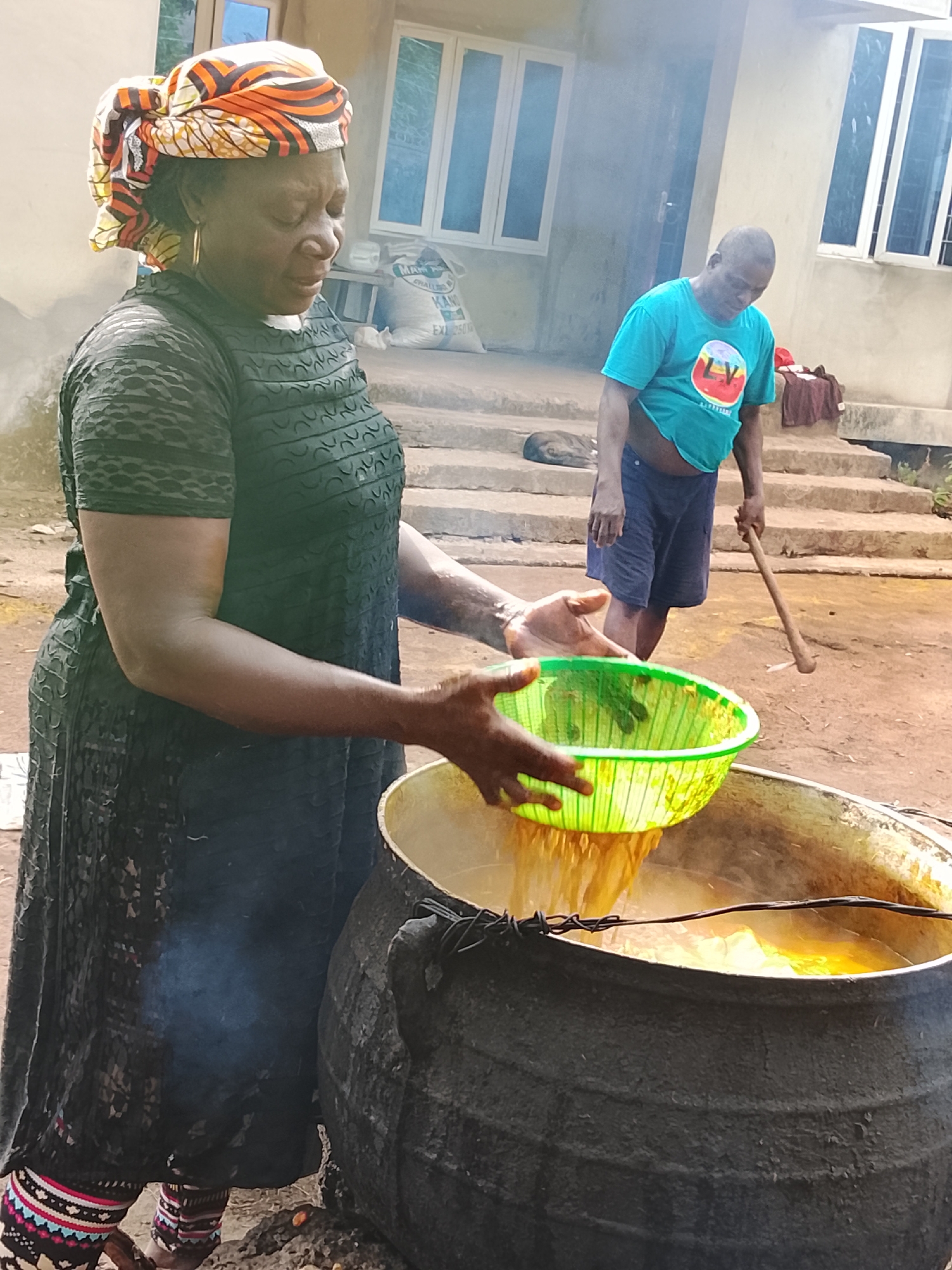 Women conduct traditional food processing activities in Akwanga, Nigeria