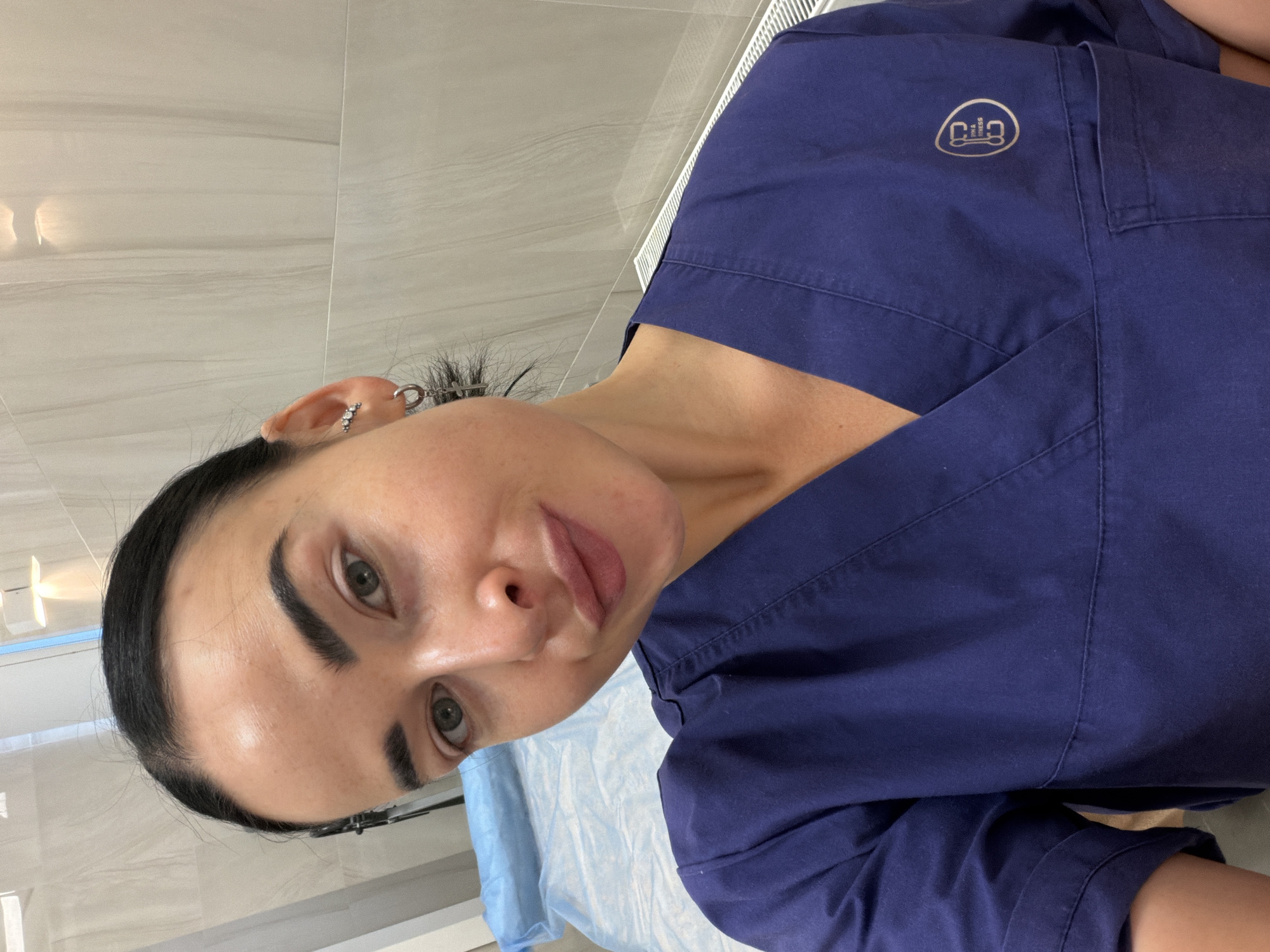 Healthcare worker holds walnut in medical room, Saint Petersburg