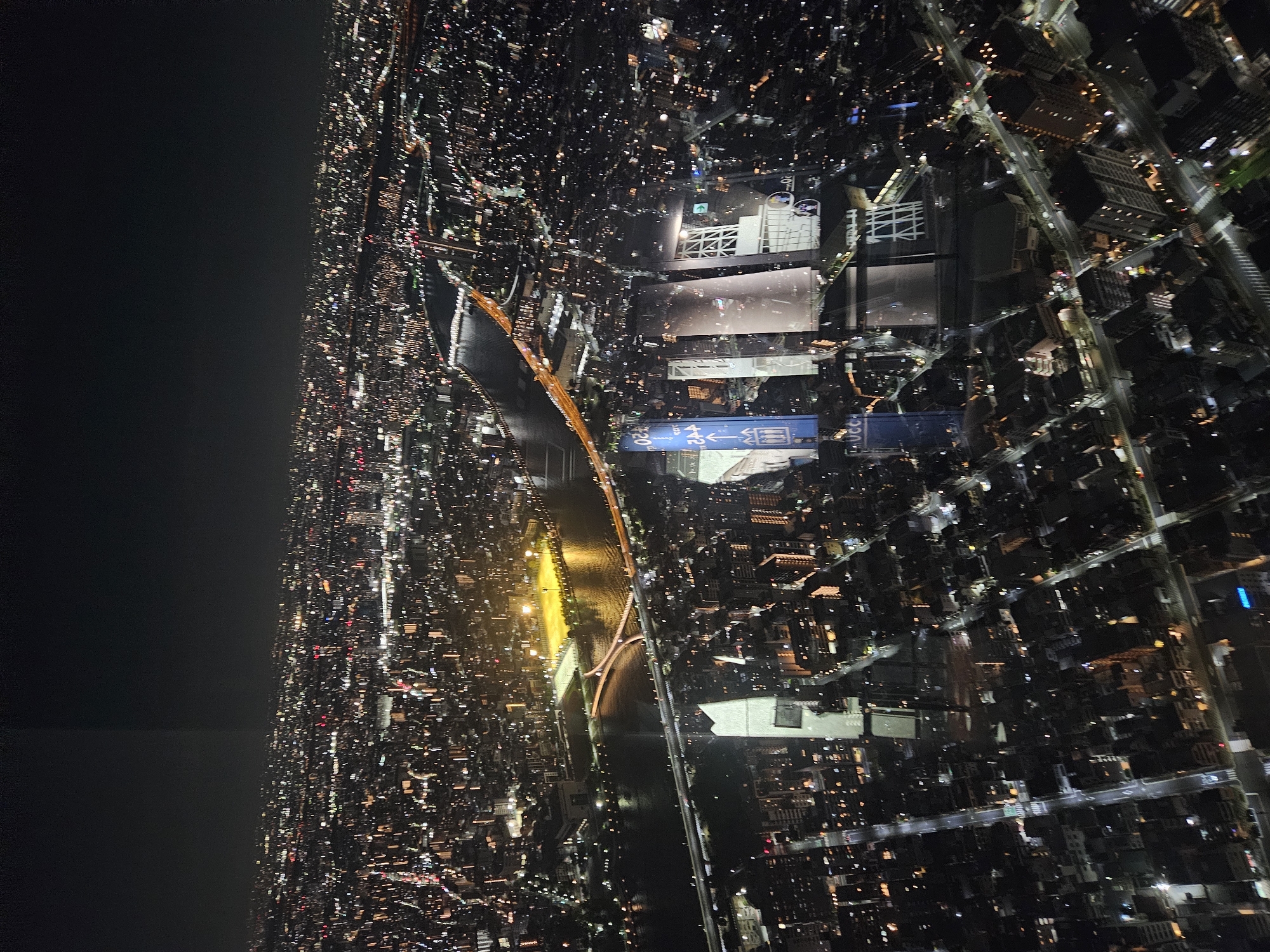 Aerial night view captures illuminated Sumida district, Japan