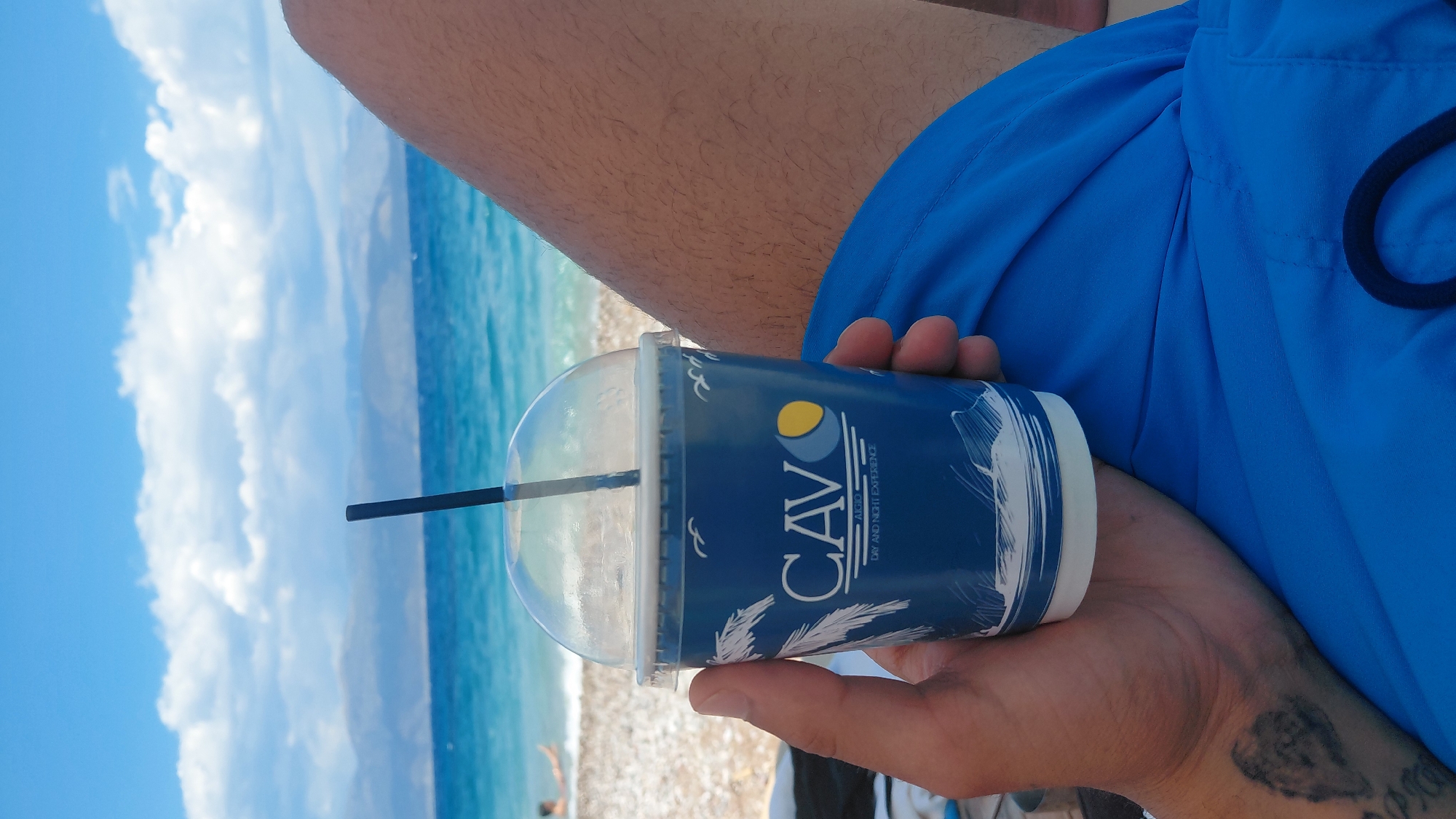 Relaxed summer morning at a pebble beach in Aigio, Greece