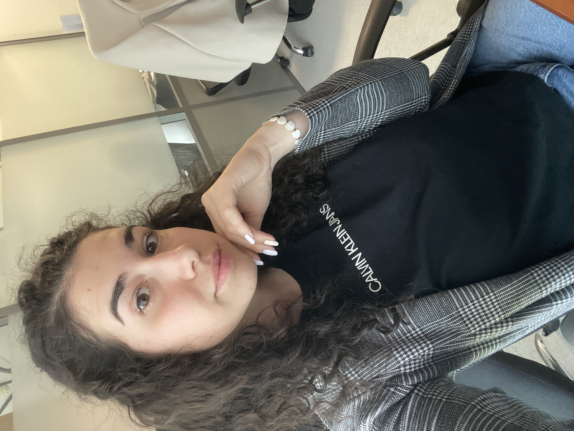 Woman works at Sofia office with broken keyboard