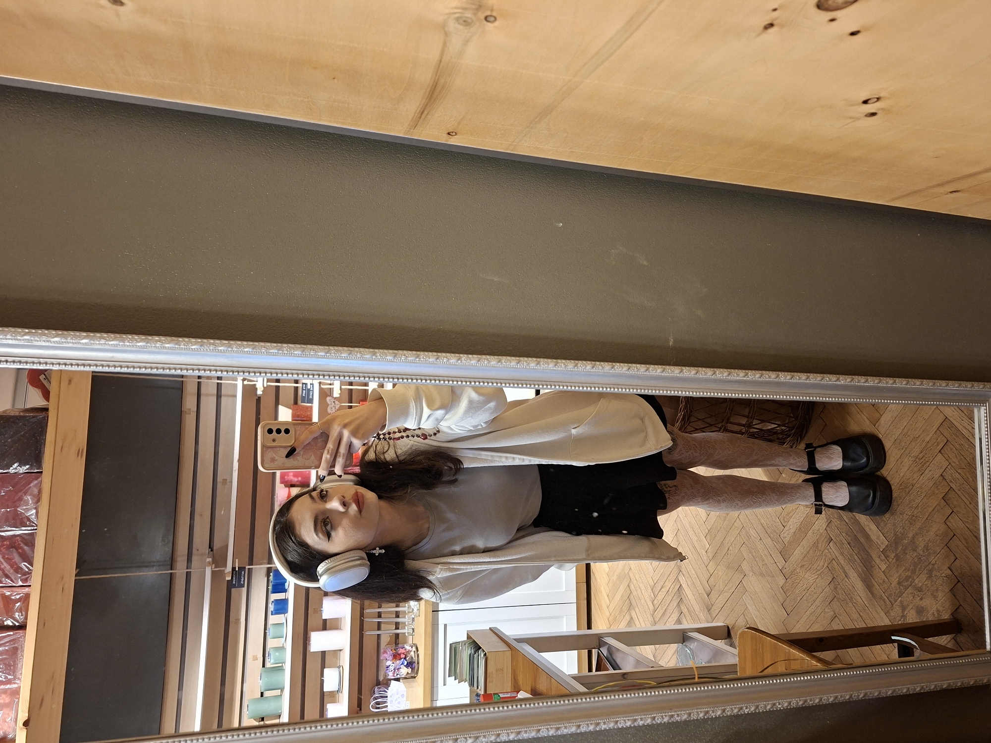 Woman photographed in mirror reflection, Sofia interior space