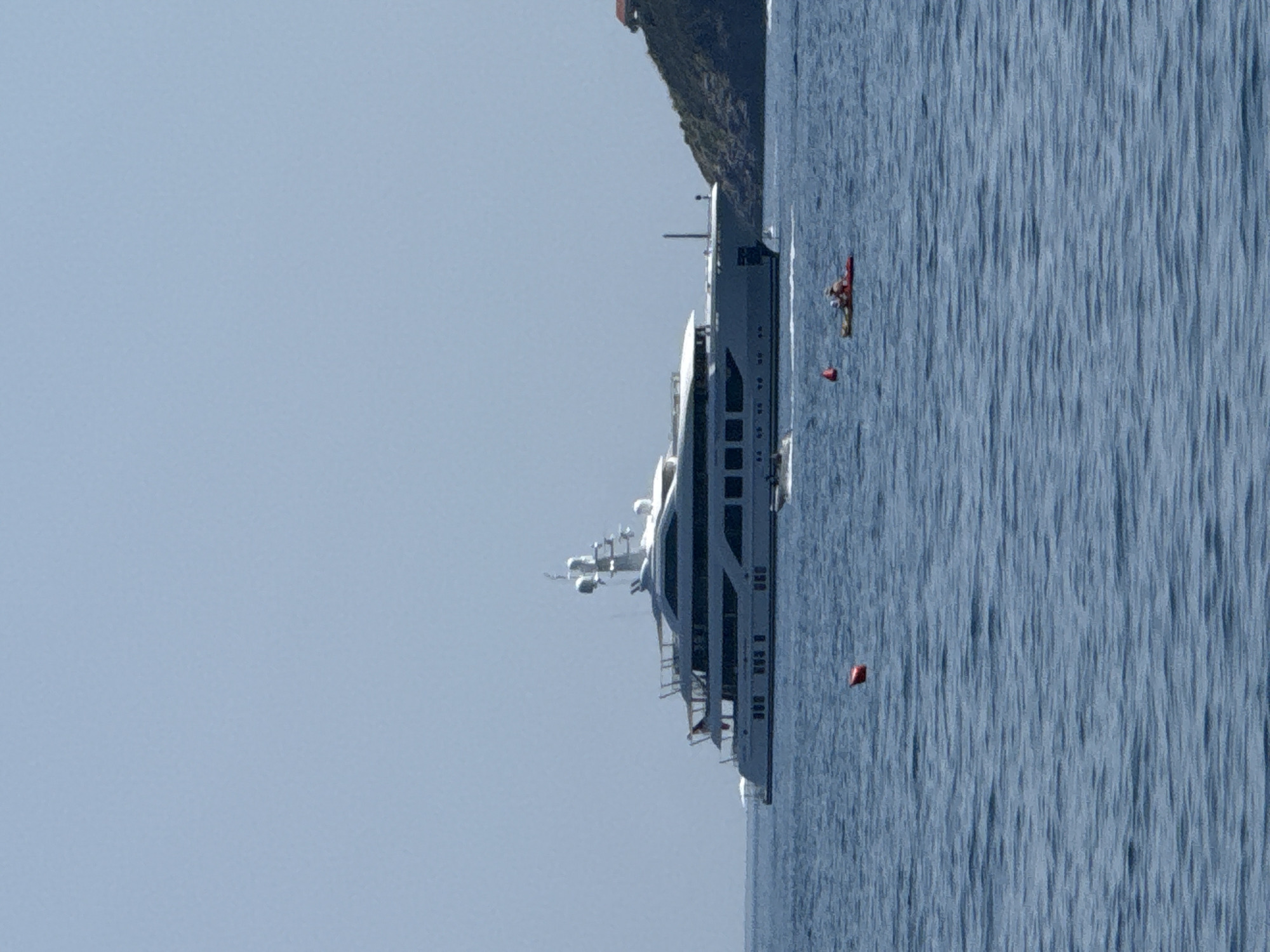 Budva's coastline in full summer swing — beaches, boats, and parasails