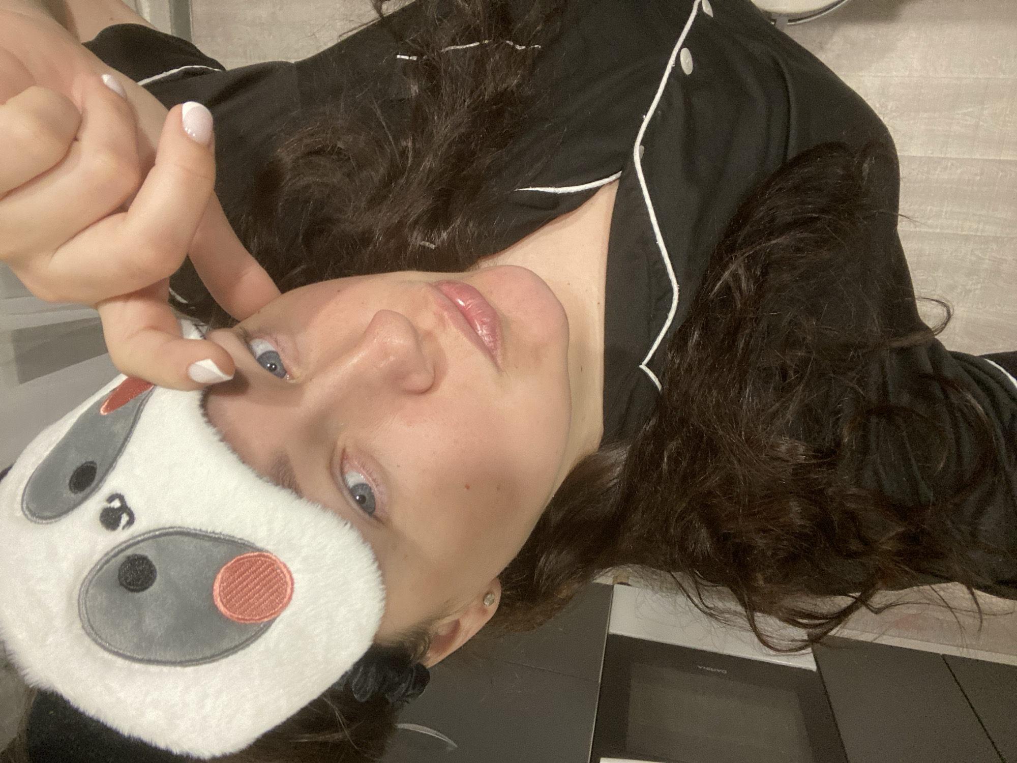 Woman in panda sleep mask captured in morning routine, Sochi