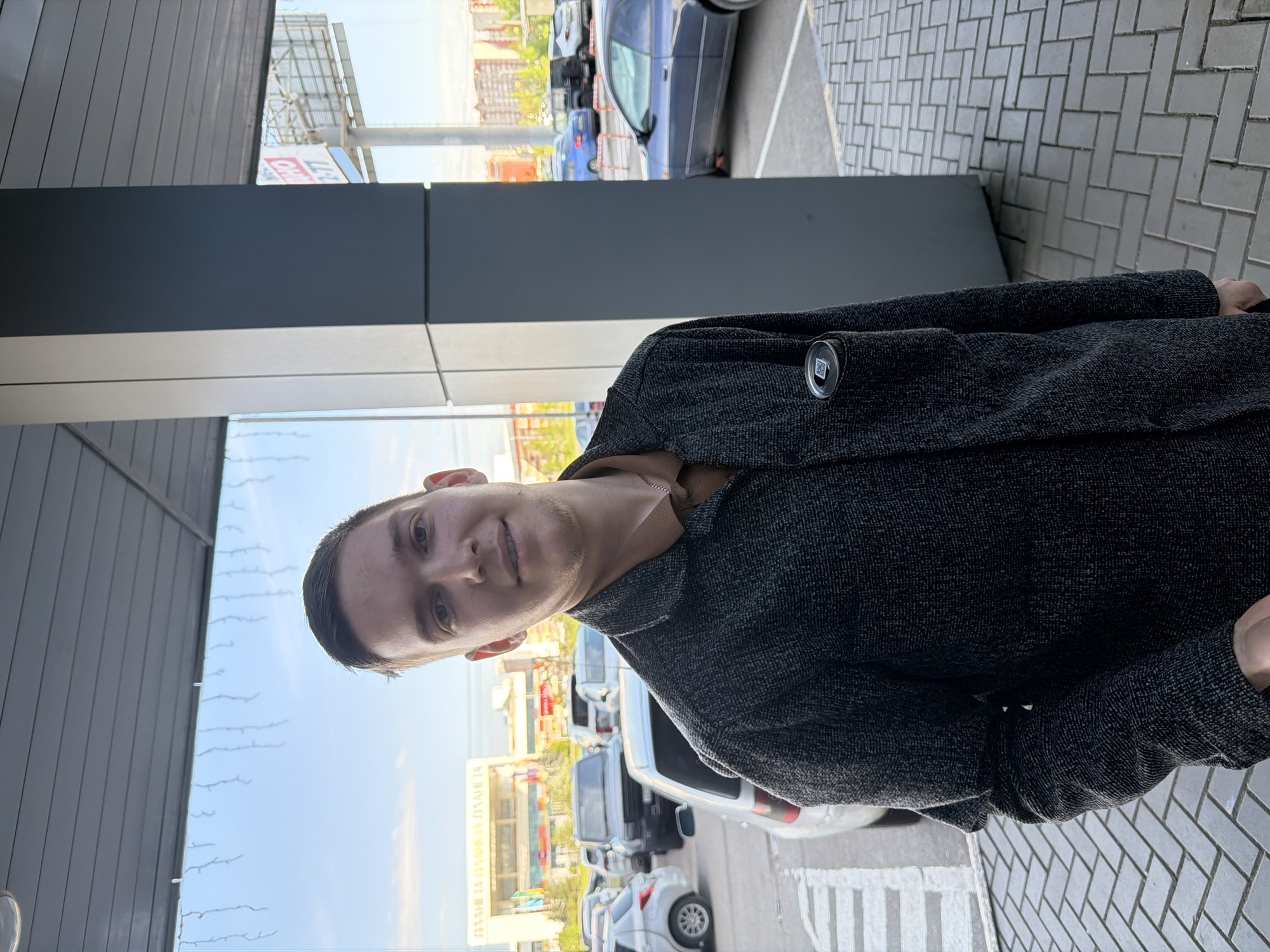 Man photographed on Krasnoyarsk street amid modern buildings