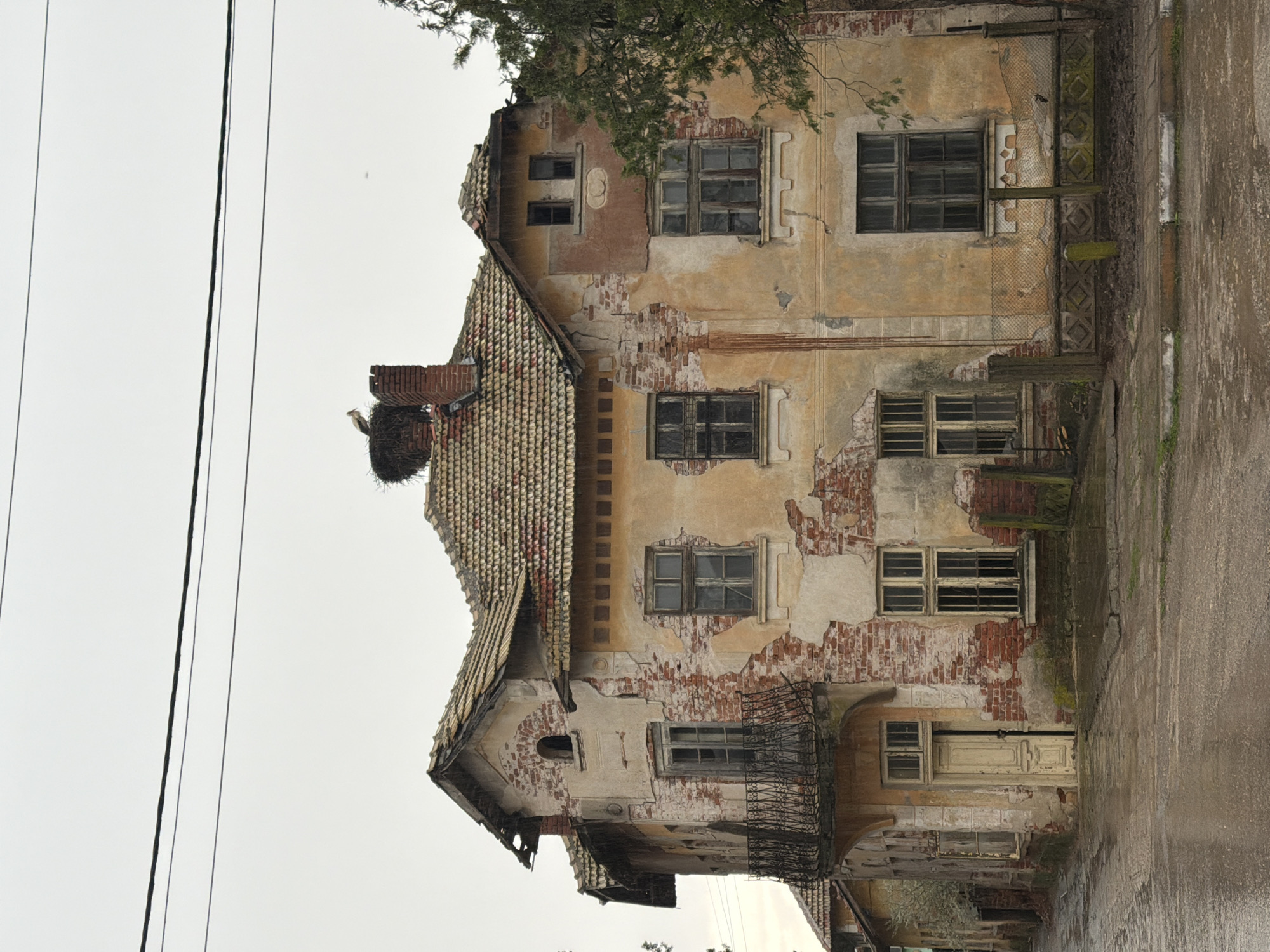 Decaying building with bird nest documented in Bulgarian village