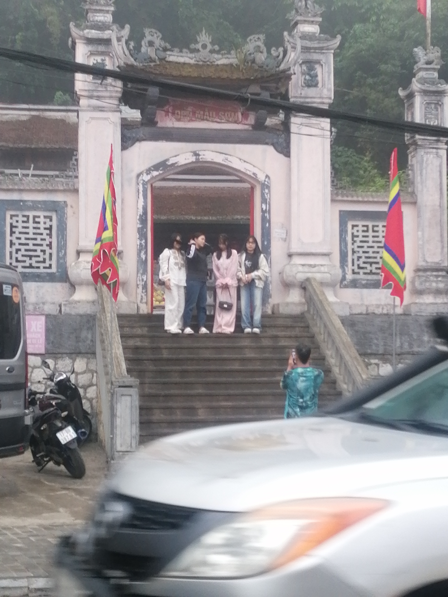 Tourists photograph at Vietnamese temple in Sa Pa Ward