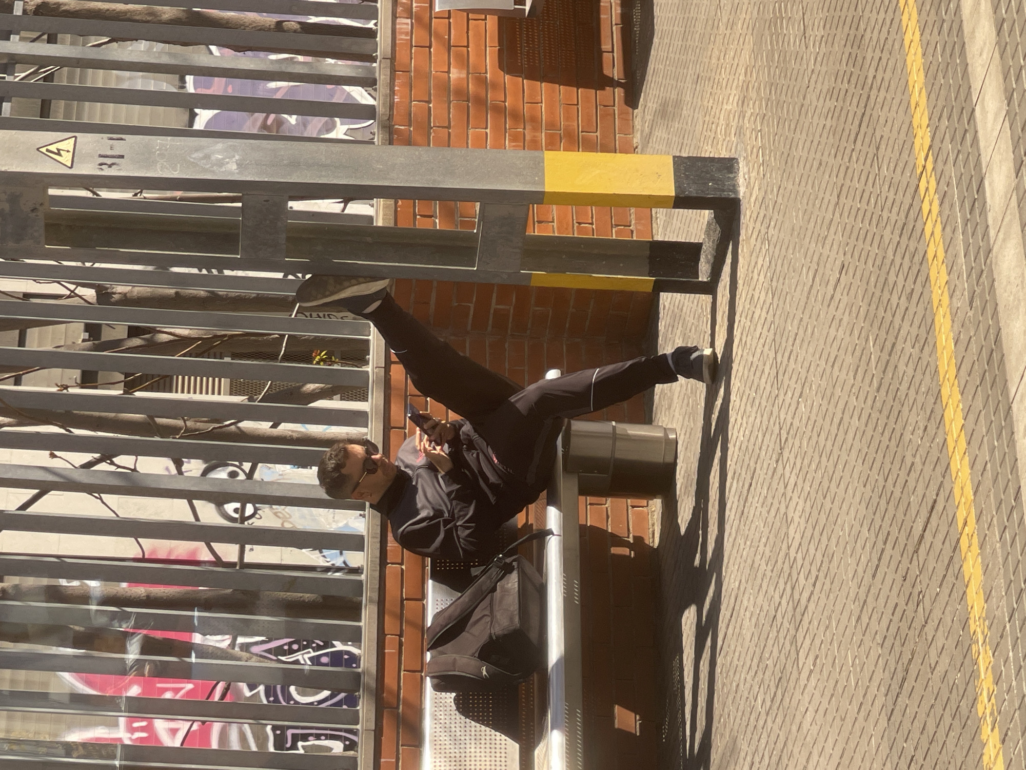 Man sits on public bench in Spanish town