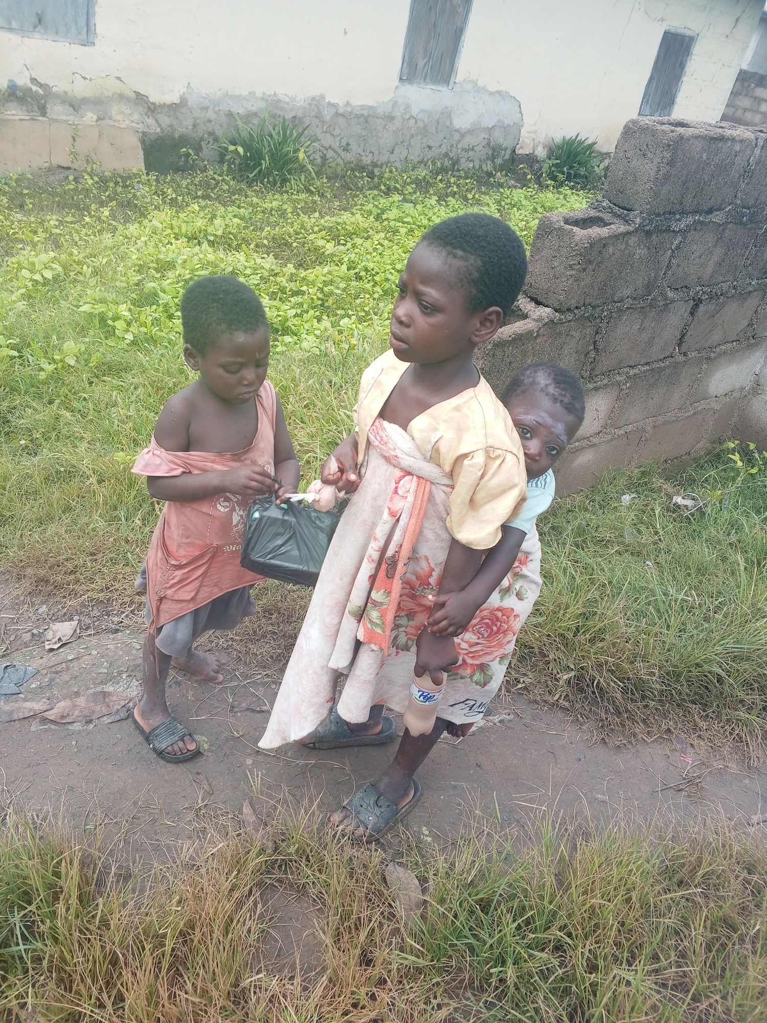 Afternoon hangout on a dirt road in Gindin Dutse, Nigeria