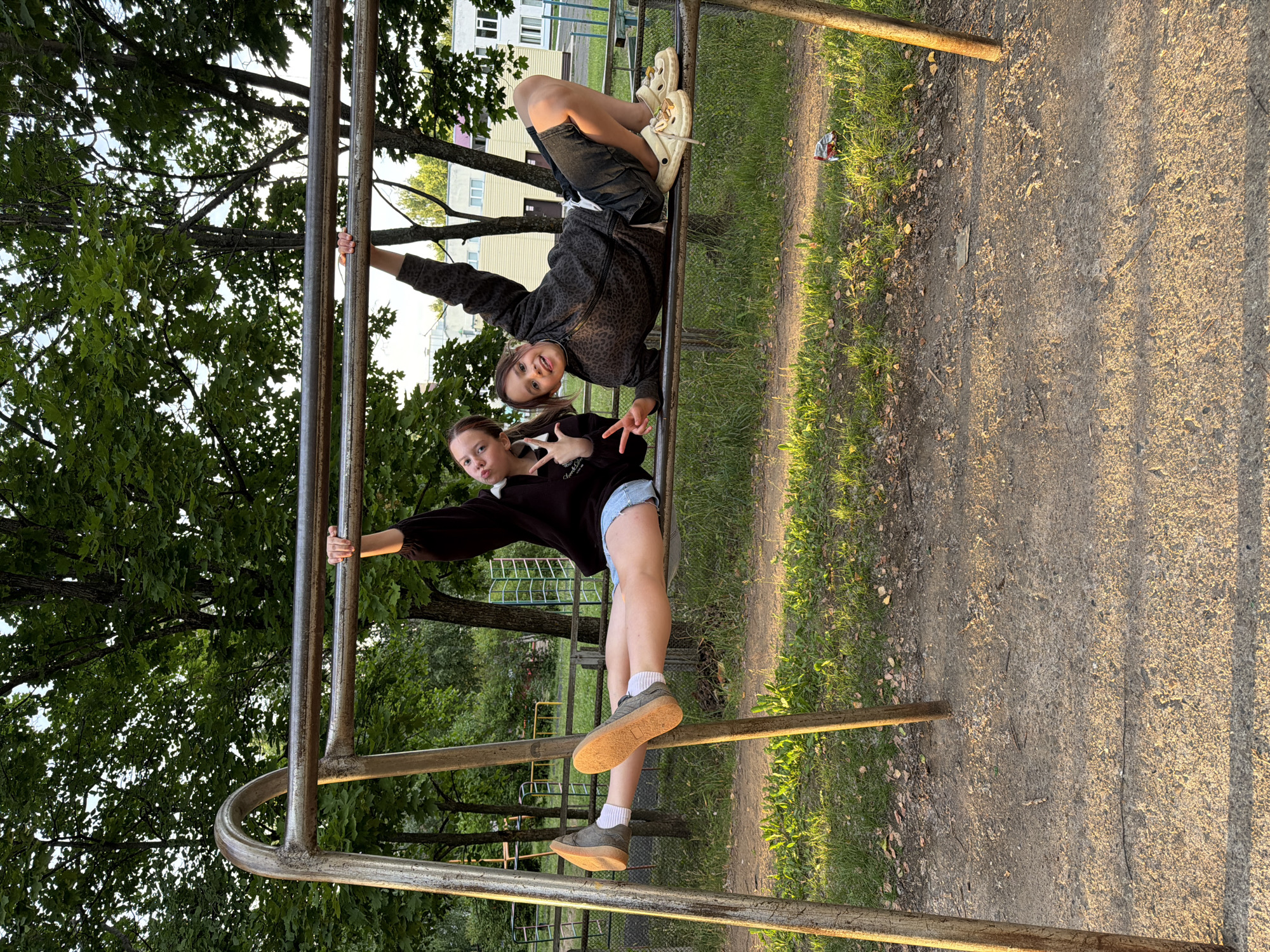 Kids playing at a Chaikovsky playground as the sun sets