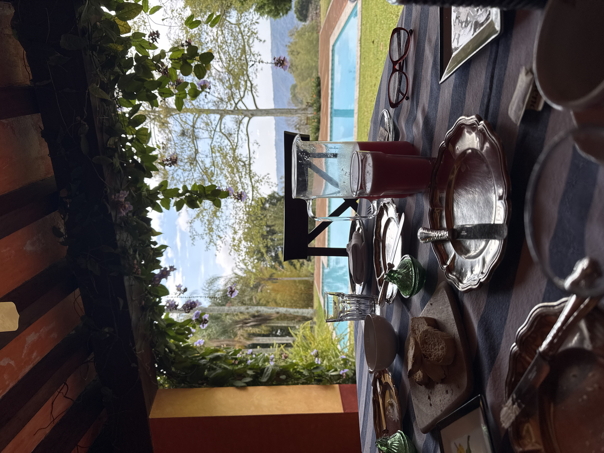 Meal table set with pink drink and bread in Mexico