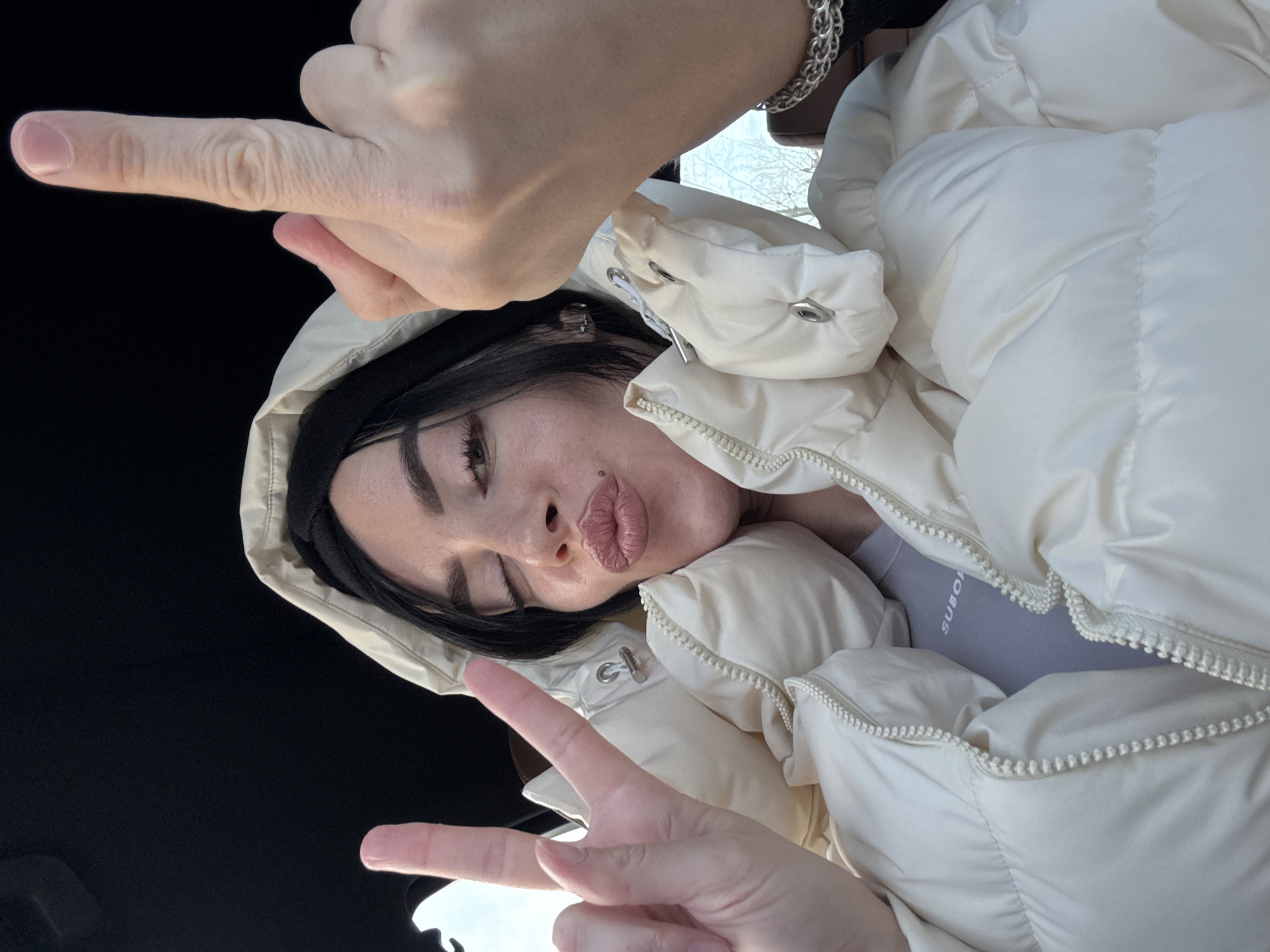 Woman takes selfie with peace sign in Krasnoyarsk