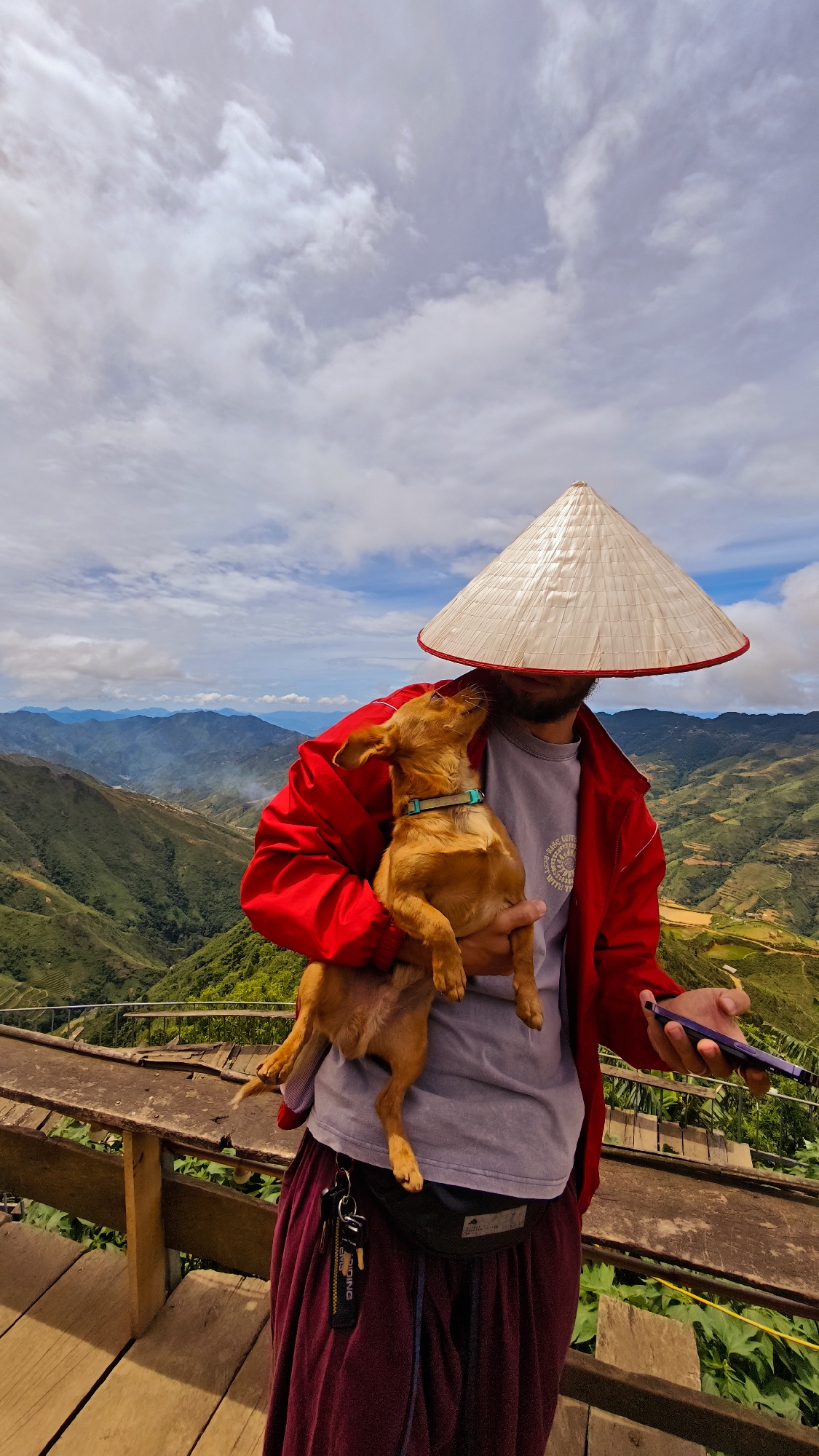 Tourists pose with dogs at Ta Xua Vietnam scenic overlook