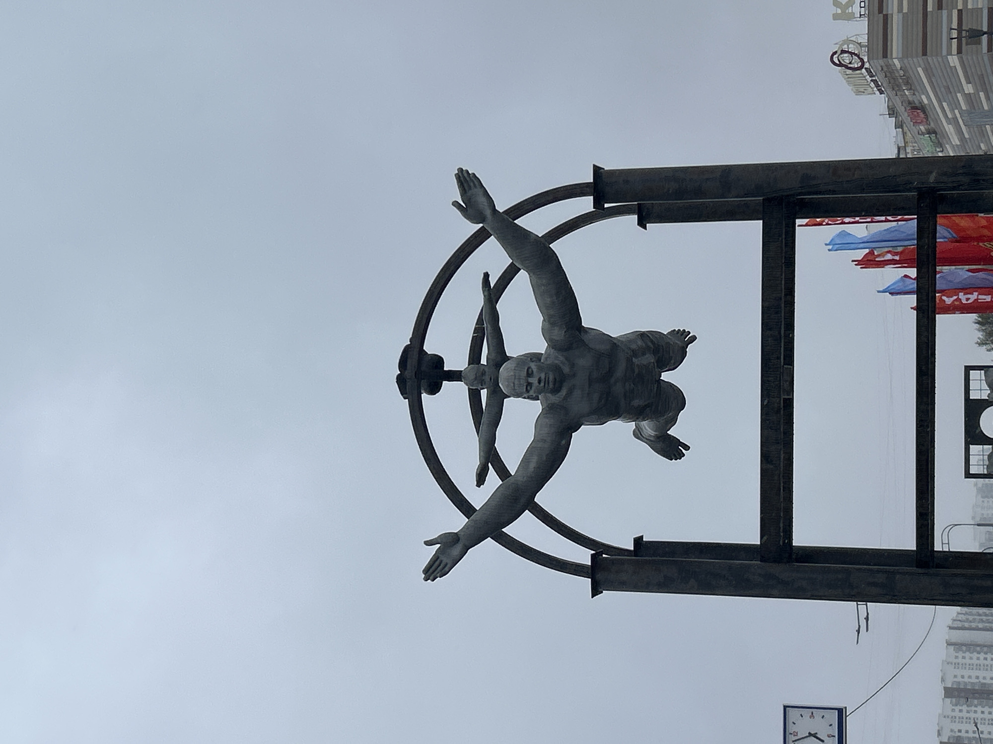 Dark monument photographed against overcast sky in Moscow
