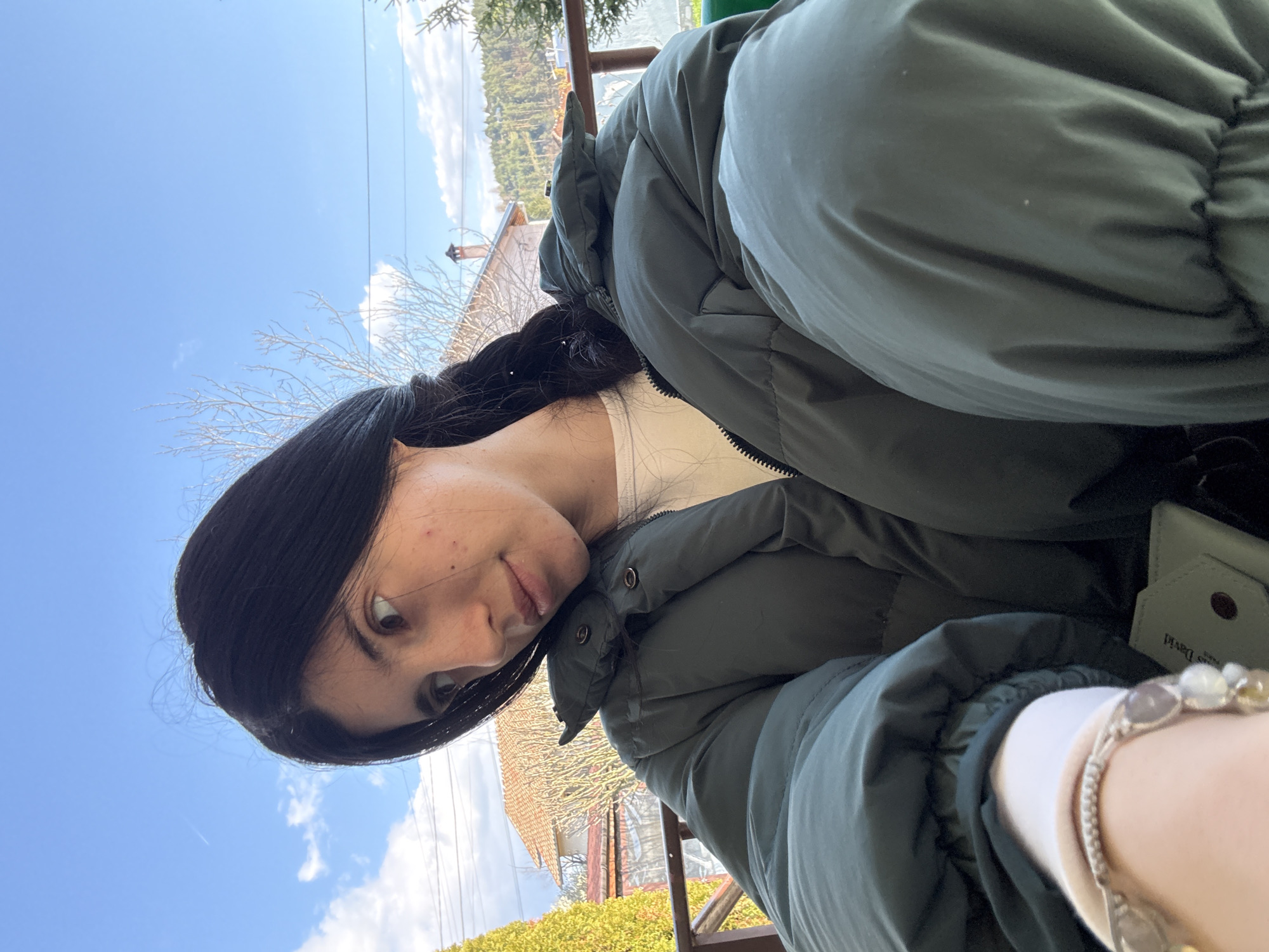 Woman spends afternoon on stone veranda in Chavdar, Bulgaria