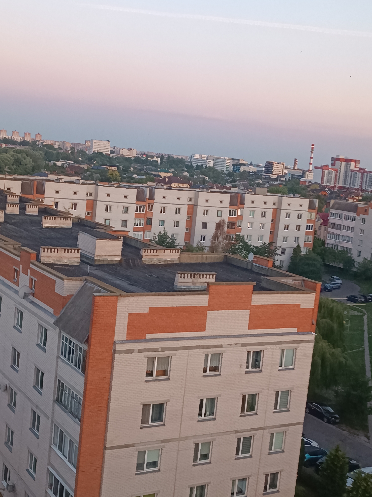 Dusk settles over Brest's residential outskirts from above