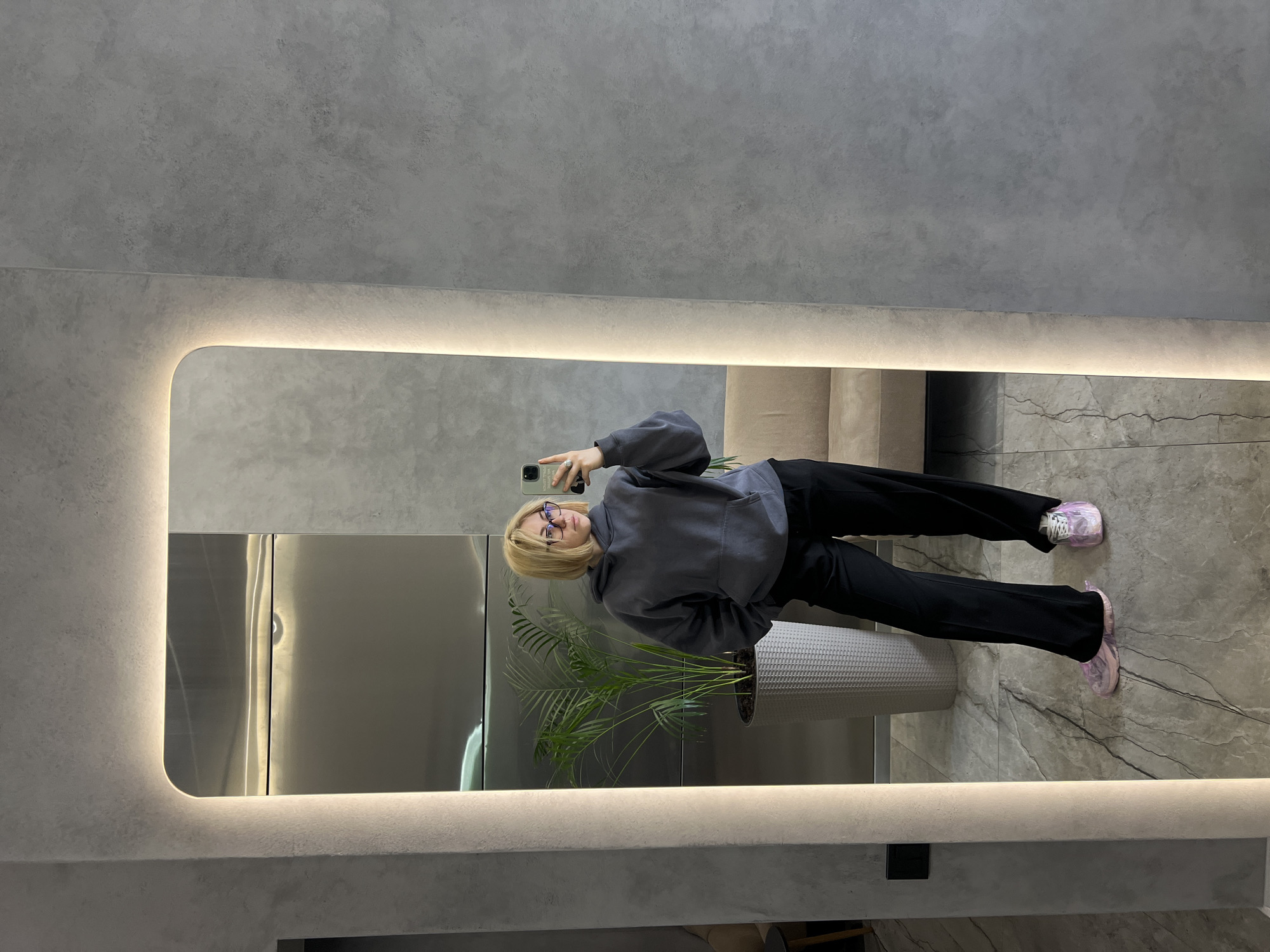 Woman takes mirror selfies in Odesa apartment